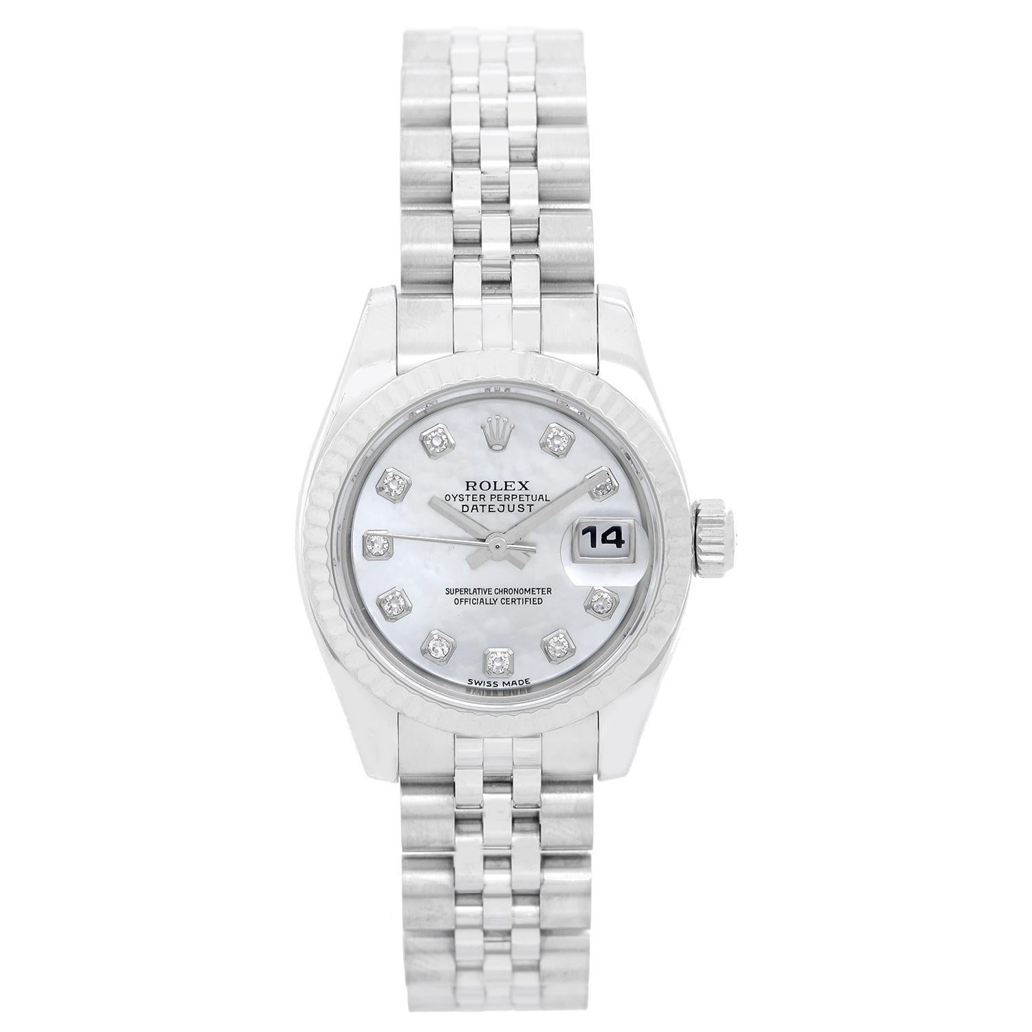 Rolex Ladies Datejust Stainless Steel Watch 179174 -  Automatic winding, 31 jewels, sapphire crystal. Stainless steel case with 18k white gold fluted bezel  (26mm diameter). Rolex white mother of pearl dial with diamond hour markers. Stainless steel