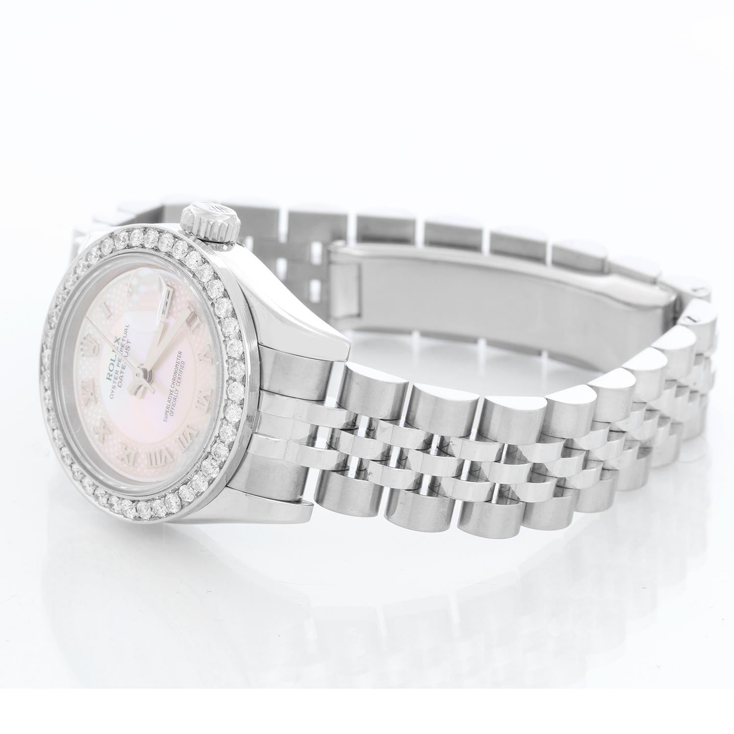 Rolex Ladies Datejust Stainless Steel Watch 179174 - Automatic winding, 31 jewels, sapphire crystal. Stainless steel case with  factory diamond bezel ( 26 mm ) . Rolex Mother of Pearl Myriad dial with Roman numerals. Stainless steel hidden-clasp