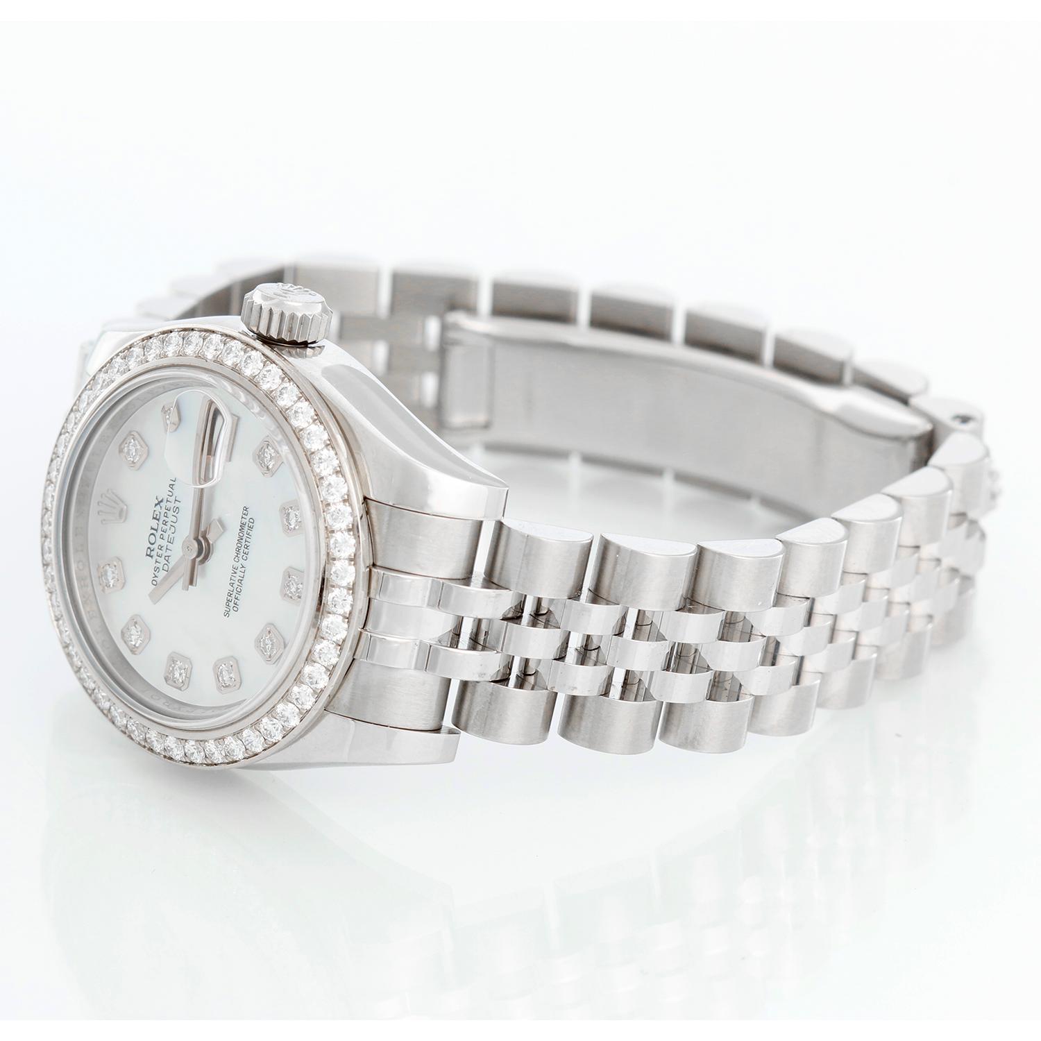Rolex Ladies Datejust Stainless Steel Watch 179384 - Automatic winding, Quickset, 31 jewels, sapphire crystal. Stainless steel case with diamond bezel ( 26 mm). White Mother of Pearl with 10 diamonds. Stainless steel Jubilee bracelet. Pre-owned with