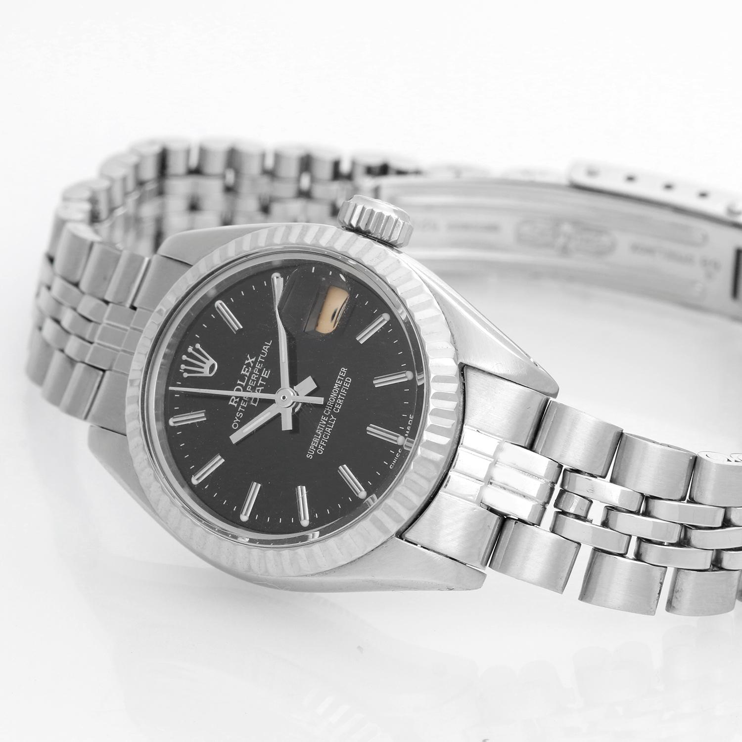 Rolex Ladies Datejust Stainless Steel Watch  6917 - Automatic winding. Stainless steel case ( 26 mm ). Black stick dial. Stainless steel bracelet. Pre-owned with custom box .