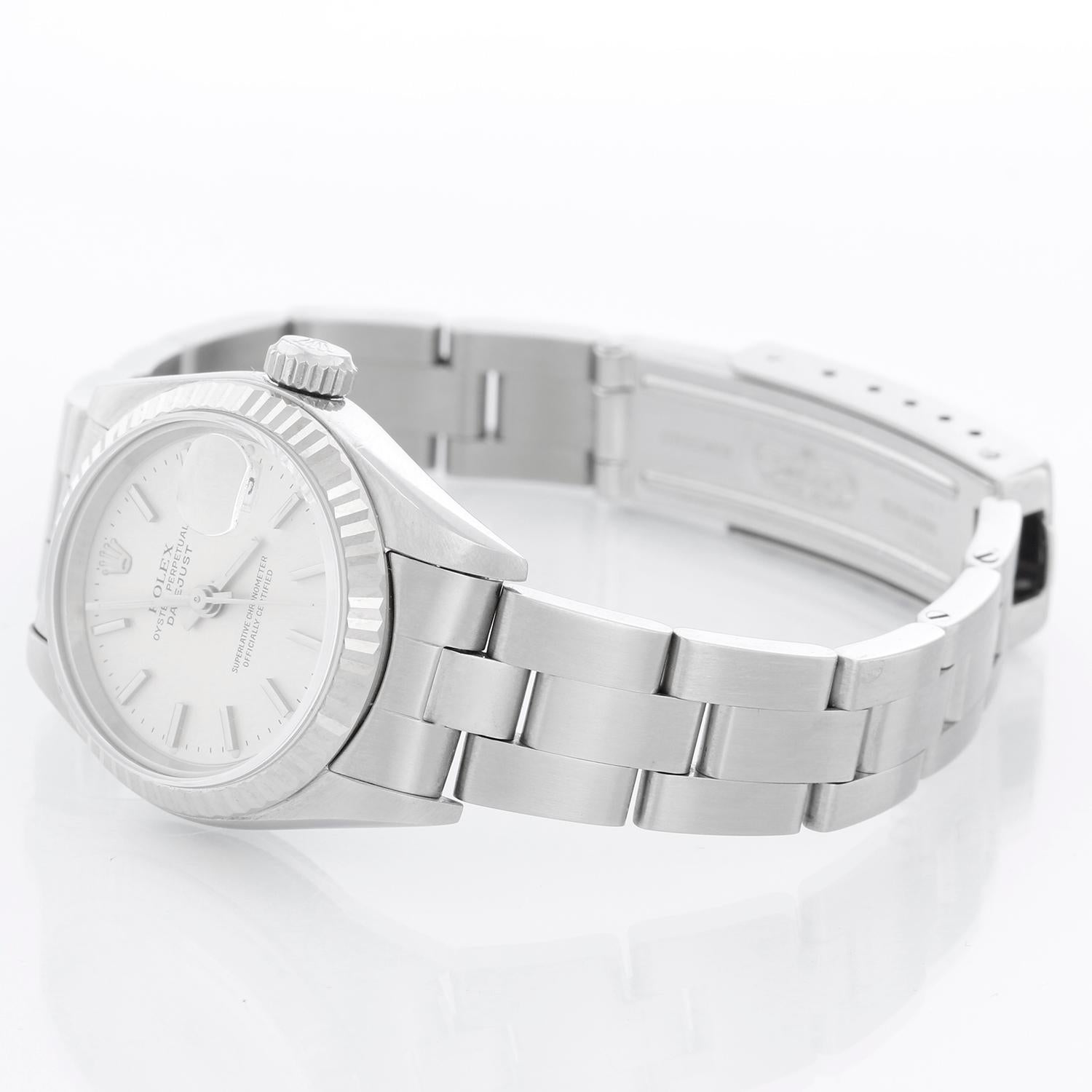 Rolex Ladies Datejust Stainless Steel Watch 69174 - Automatic winding. Stainless steel case with 18k white gold fluted bezel . Silver dial with stick hour markers. Stainless steel Oyster bracelet. Pre-owned with custom box.