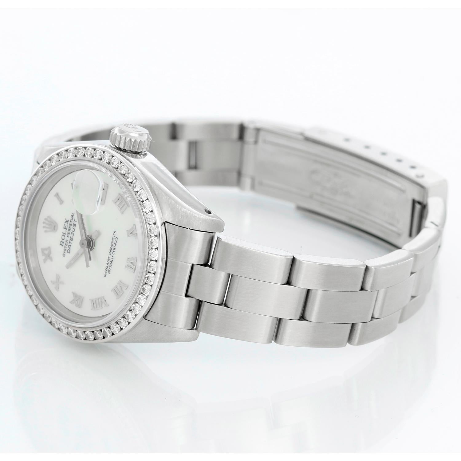 Rolex Ladies Datejust Stainless Steel Watch 69174 - Automatic winding. Stainless steel case with custom diamond bezel ( 26 mm ) . Custom Mother of pearl Roman dial. Stainless Steel oyster band. Pre-owned with custom box.