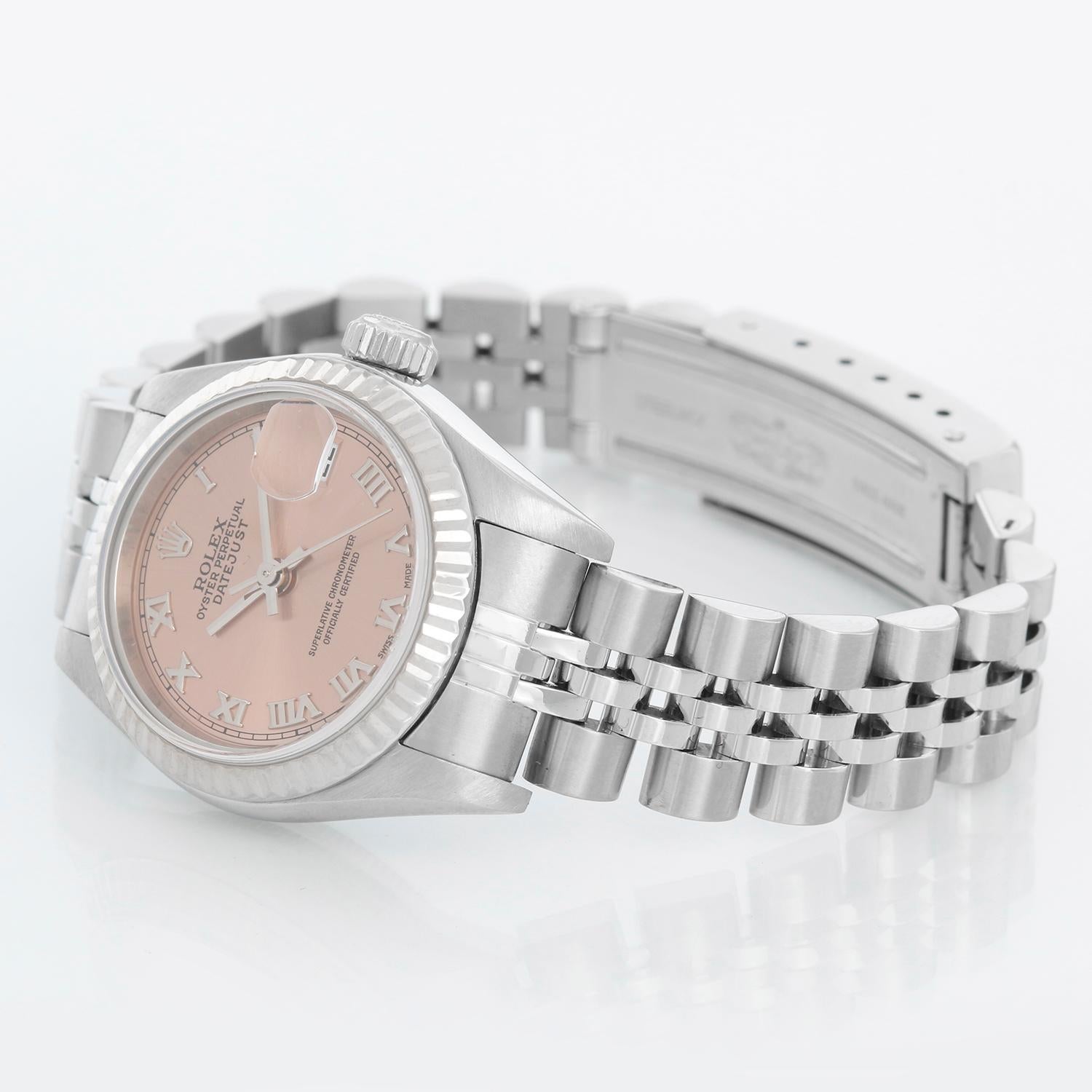Rolex Ladies Datejust Stainless Steel Watch 79174 - Automatic winding. Stainless steel case with 18k white gold Fluted bezel (26mm diameter). Salmon dial with Roman numerals. Stainless steel Rolex jubilee bracelet. Pre-owned with custom box with