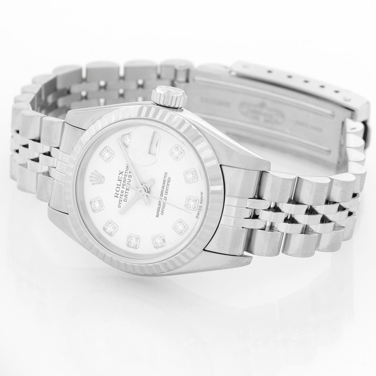 Rolex Ladies Datejust Stainless Steel Watch White Dial 79174 - Automatic winding. Stainless steel case with 18k white gold Fluted bezel (26mm diameter). Factory white diamond dial. Stainless steel Rolex Jubilee bracelet. Pre-owned with custom box