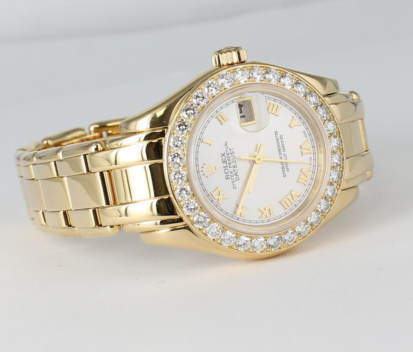 Rolex Ladies Masterpiece/Pearlmaster Gold Diamond Watch 69298 - Automatic winding, 31 jewels, Quickset, sapphire crystal. 18k yellow gold case with factory diamond bezel (29mm diameter). Factory Rolex Mother of Oyster dial. 18k yellow gold