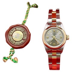 Rolex Damen Oyster Perpetual 67243 Stahl arabisches Zifferblatt 18K Gold Stahl Box Papier
