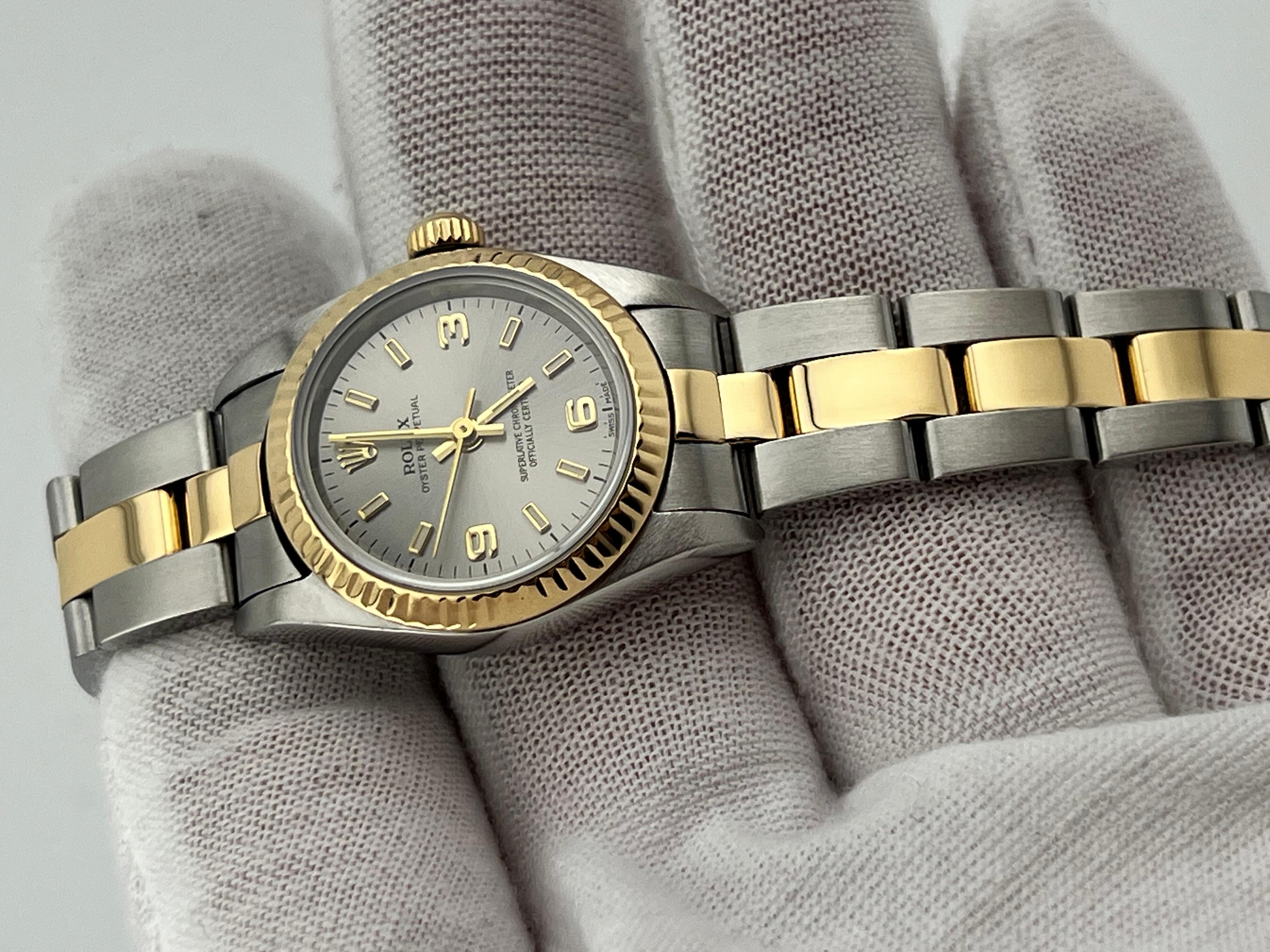 Rolex Damen Oyster Perpetual 76193 Silber Zifferblatt 18K Gelbgold Stahl Box Papier 10