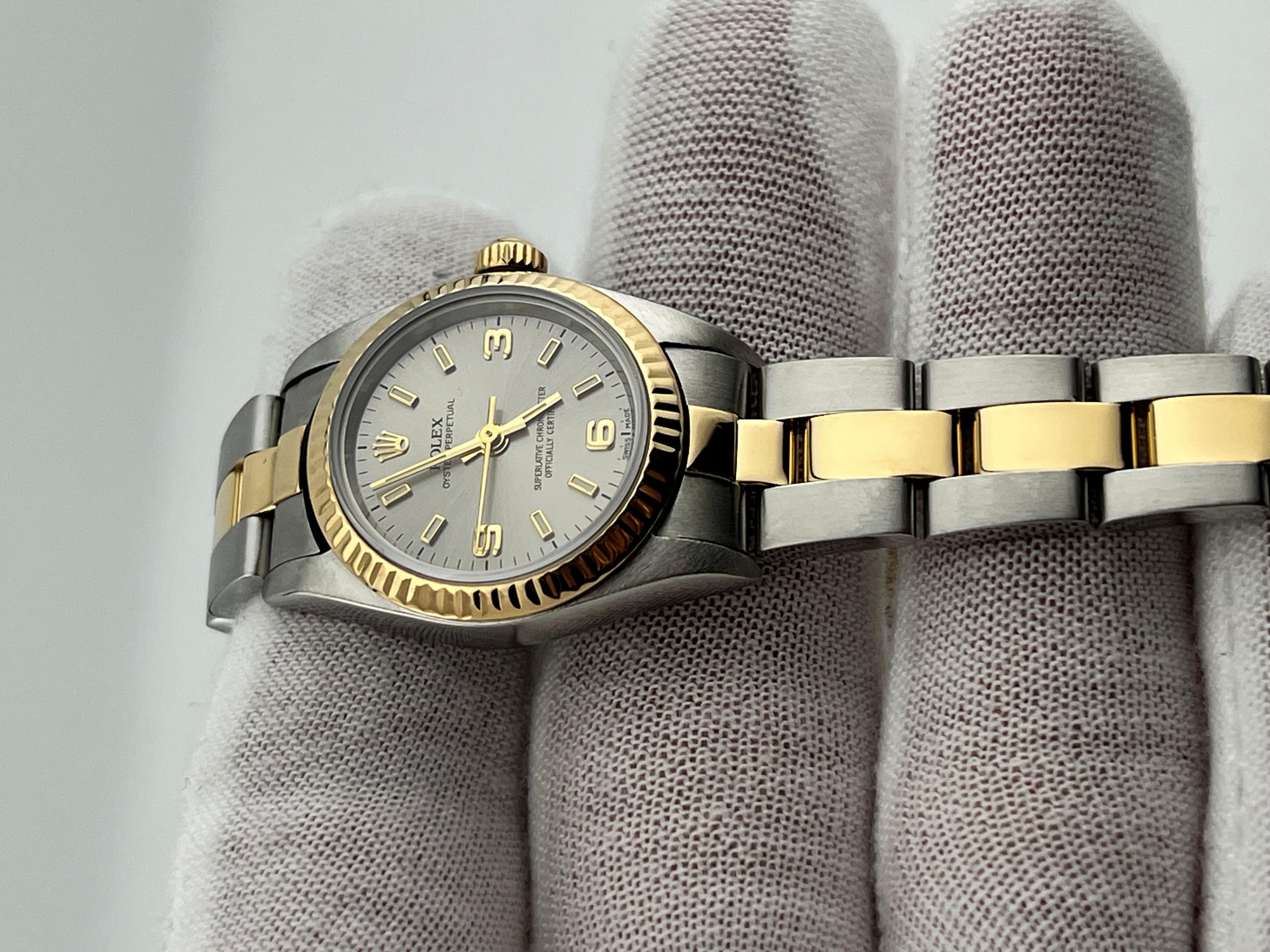 Rolex Damen Oyster Perpetual 76193 Silber Zifferblatt 18K Gelbgold Stahl Box Papier 1