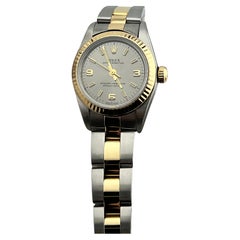 Rolex Damen Oyster Perpetual 76193 Silber Zifferblatt 18K Gelbgold Stahl Box Papier