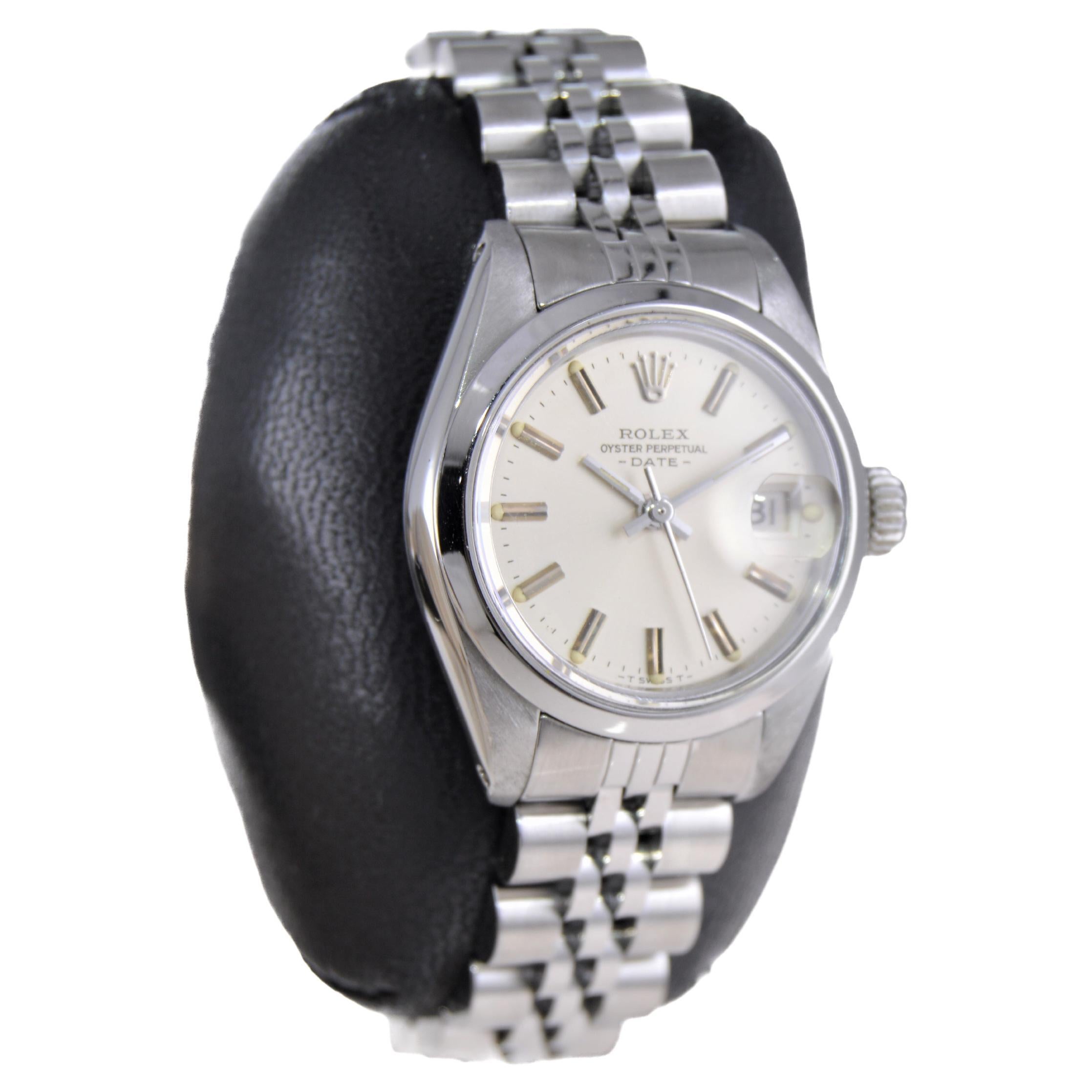 FACTORY / HOUSE: Rolex Watch Company
STYLE / REFERENCE: Oyster Perpetual Date / Reference 6900
METAL / MATERIAL: Stainless Steel
CIRCA / YEAR: 1982
DIMENSIONS / SIZE: Length 32mm X Diameter 26mm
MOVEMENT / CALIBER: Perpetual Winding / 26 Jewels /