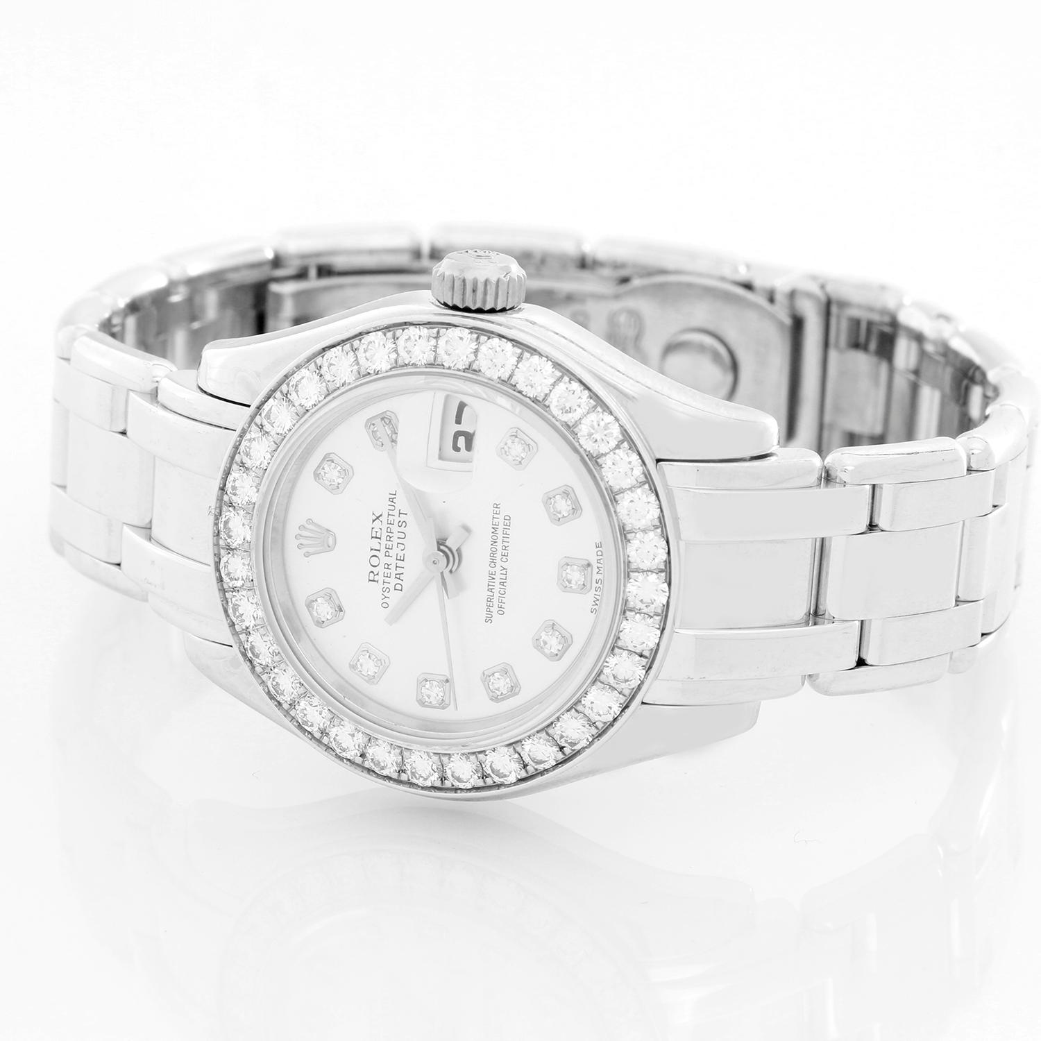 Rolex Ladies Pearlmaster 18k White Gold Watch 80299 - Automatic winding, 31 jewels, Quickset, sapphire crystal. 18k white gold case with factory 32-diamond bezel (29mm diameter). Silver dial with Rolex diamond hour markers. 18k white gold