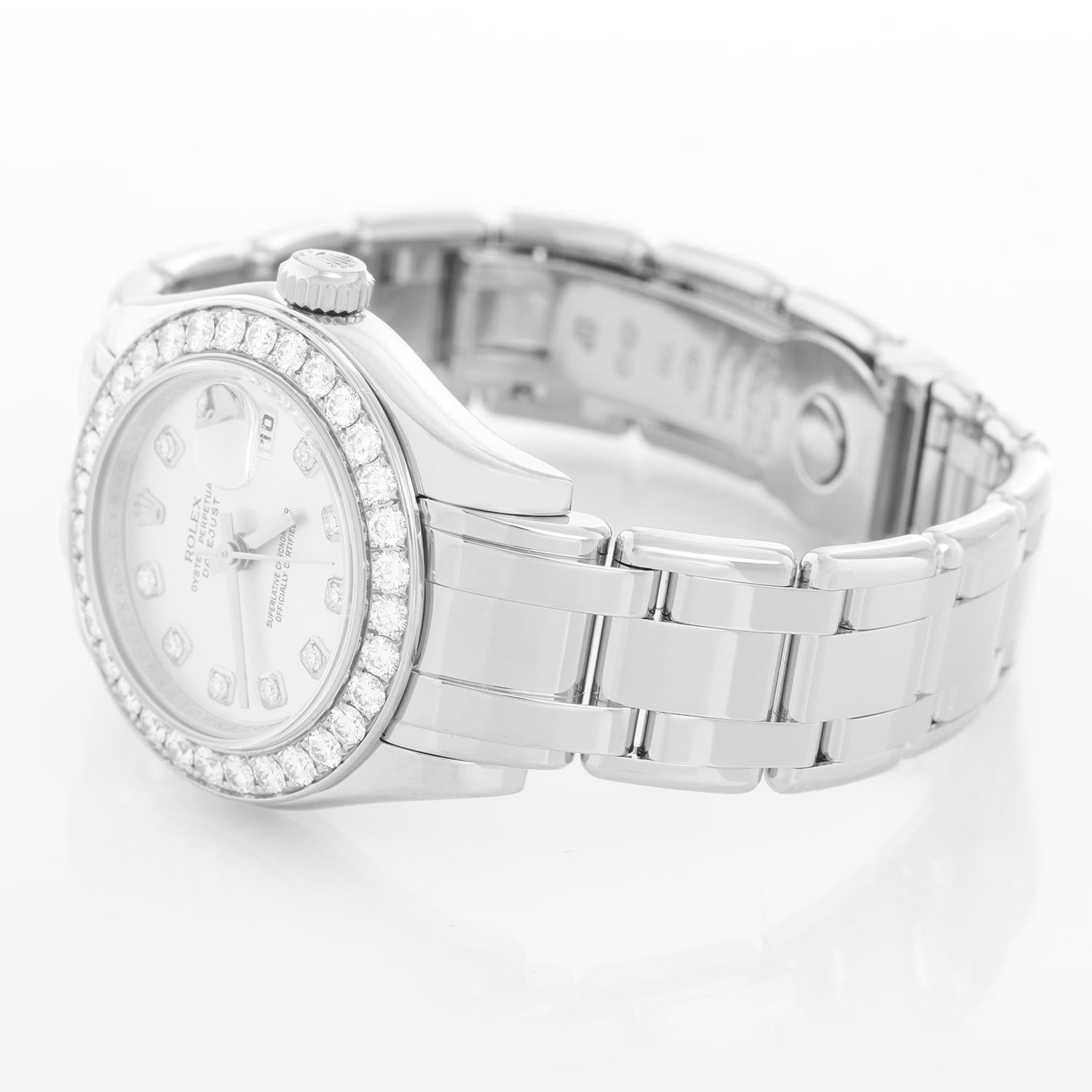 Rolex Ladies Pearlmaster 18k White Gold Watch 80299 Silver Diamond Dial - Automatic winding, 31 jewels, Quickset, sapphire crystal. 18k white gold case with factory 32-diamond bezel (29mm diameter). Rolex silver diamond dial. 18k white gold