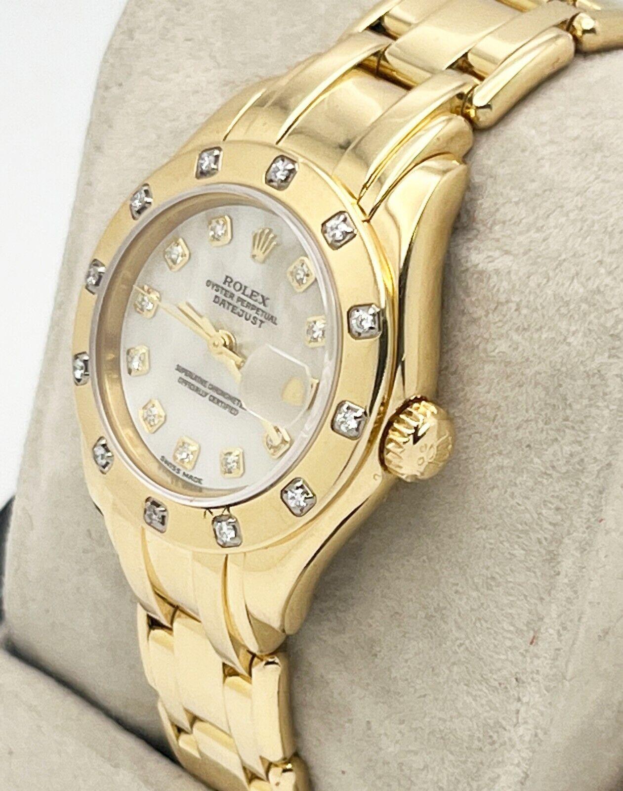 Style Number: 80318

 

Serial: F581***


Year: 2003

 

Model: Ladies Pearlmaster

 

Case Material: 18K Yellow Gold

 

Band: 18K Yellow Gold

  

Bezel: Factory Scattered Diamond Bezel

 

Dial: Factory Mother of Pearl Diamond Dial

 

Face:
