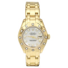 Rolex Pearlmaster 80318 Montre pour femme en or jaune 18 carats avec cadran MOP et lunette en diamants