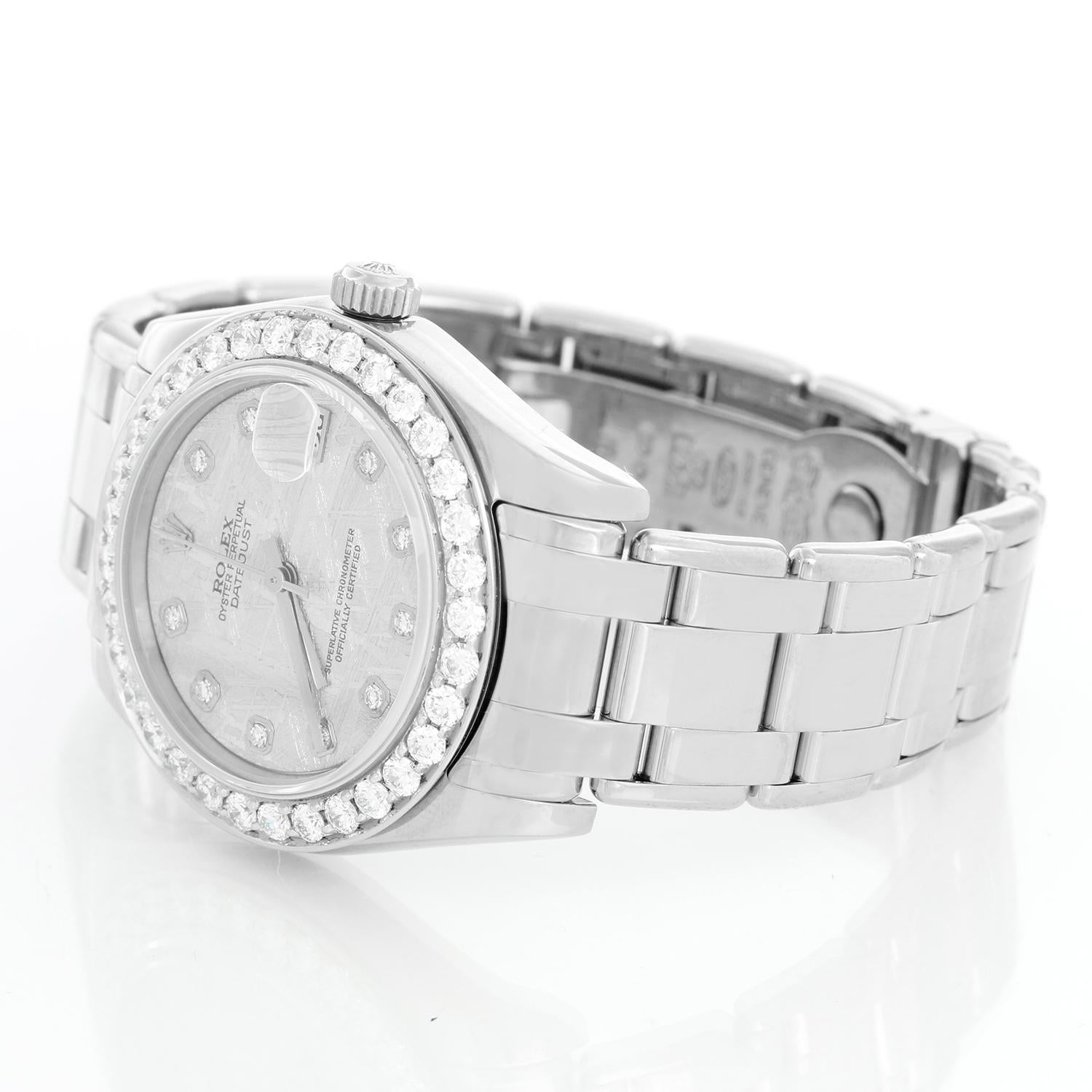 Rolex Ladies Pearlmaster Midsize White Gold Watch 81209 - Automatic winding, 31 jewels, Quickset, sapphire crystal. 18k white gold case with custom diamond bezel  (34 mm ). Factory meteorite diamond dial. 18k white gold Pearlmaster bracelet.