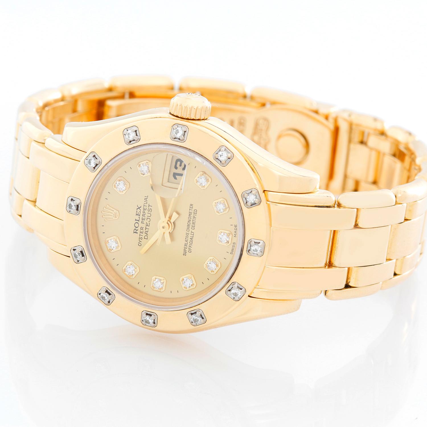 Rolex Ladies Pearlmaster Yellow Gold & Diamond Watch 69318 - Automatic winding. 18k yellow gold case with factory 12-diamond bezel (29mm diameter). Factory champagne diamond dial. 18k yellow gold Pearlmaster bracelet. Pre-owned with box and books.