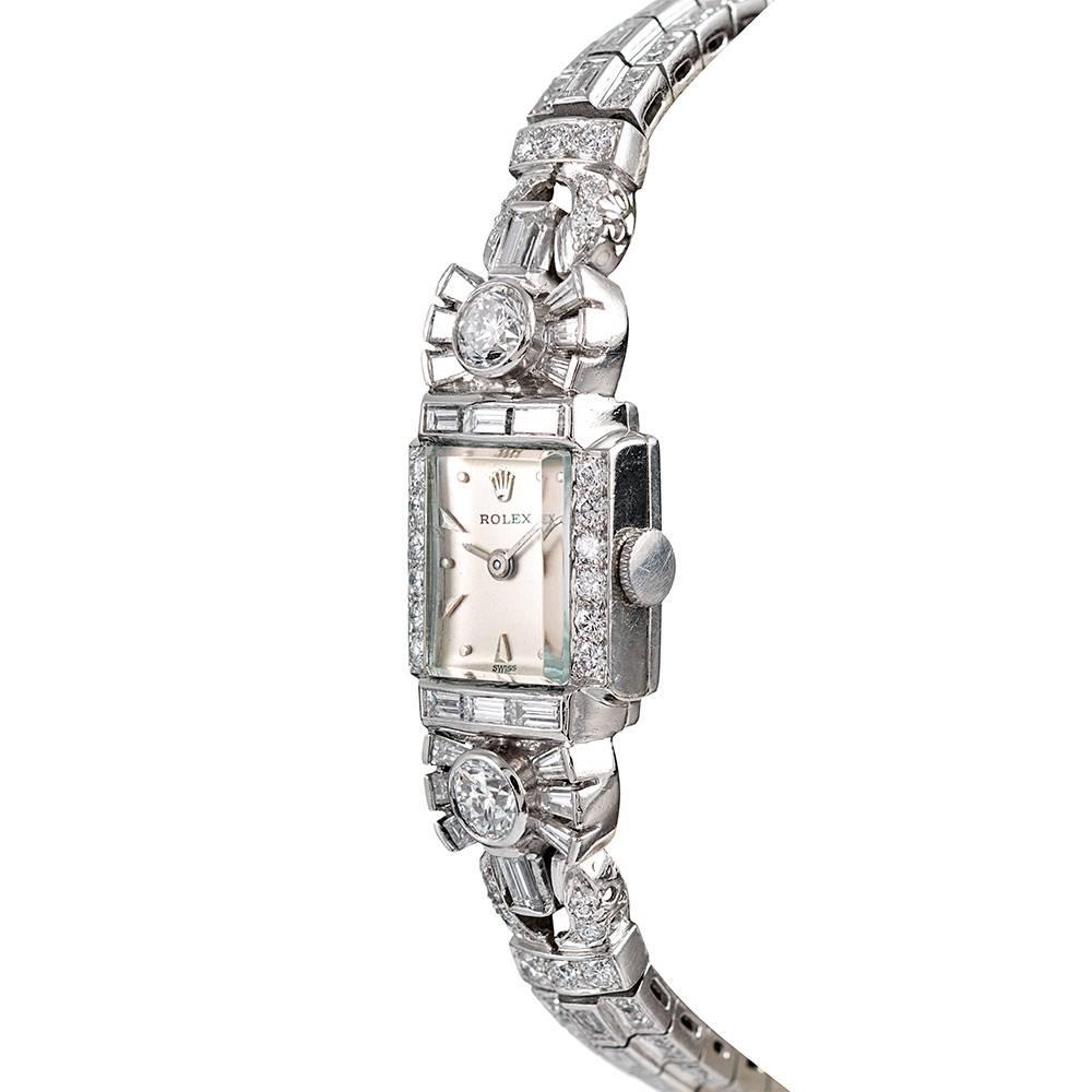 Inspired by the iconic designs of the art deco period, yet conceived in the 1950s, this exceptional creation represents what would have been among the finest lady’s time pieces of the era. Hand made in platinum, the piece boasts a lovely hand, with