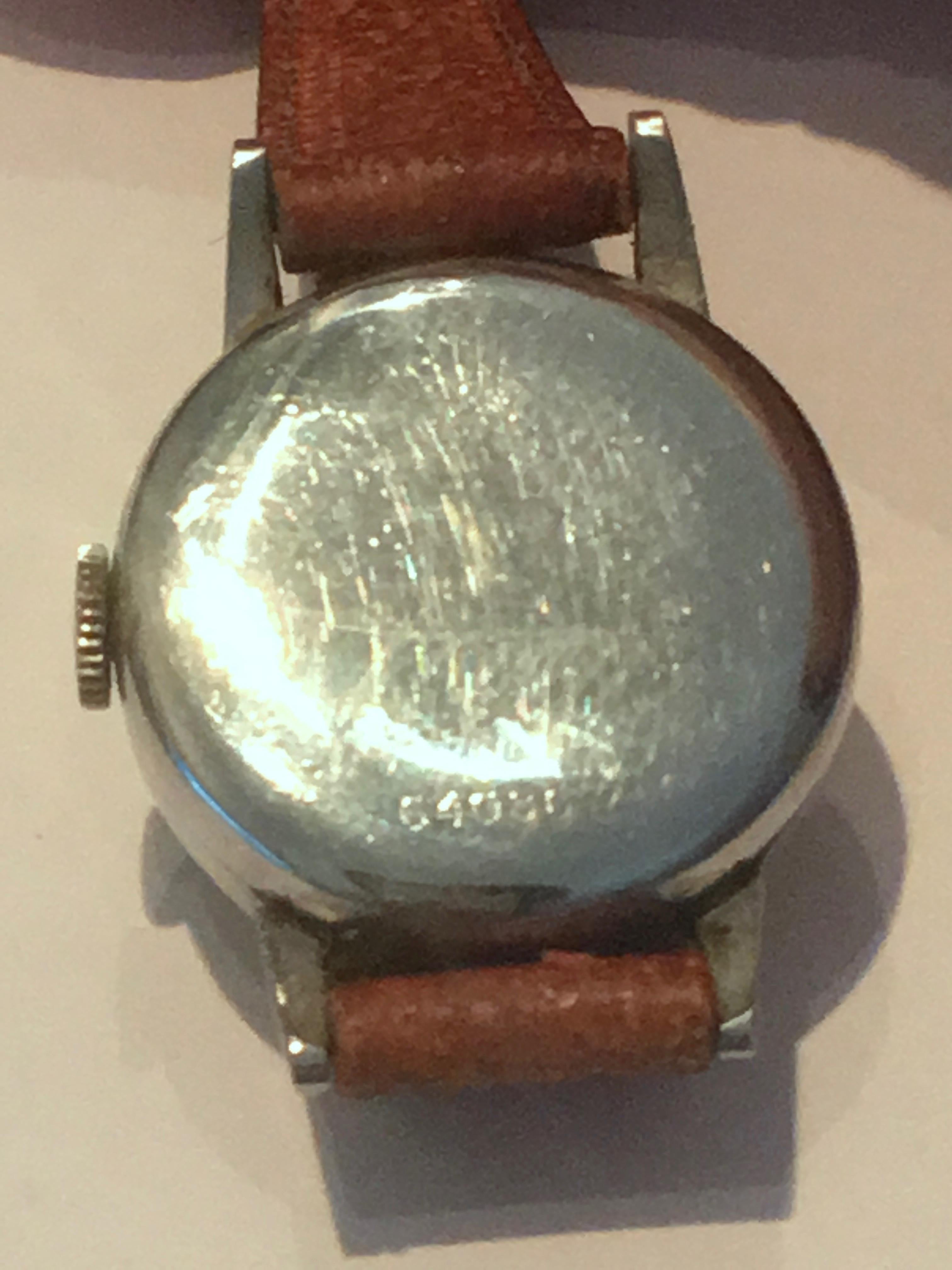 Rolex Precision 17 rubis super balance stainless steel Ladies watch.  Last two photos depict magnified details of back.  Period correct pigskin strap.