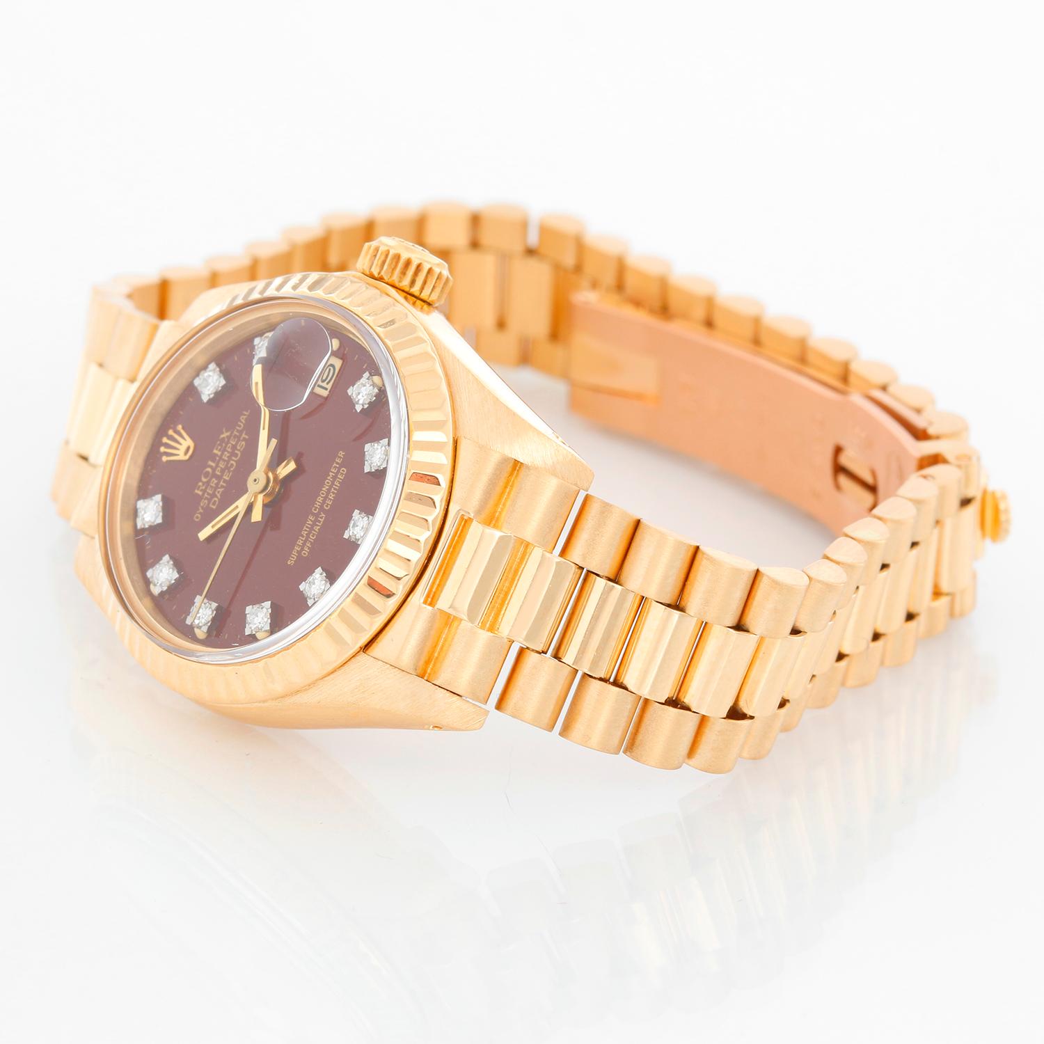 Rolex Ladies President 18K Yellow Gold 6917 Watch - Automatic winding, acrylic crystal. 18k yellow gold case with fluted bezel (26mm diameter). Factory brown Stella diamond dial . 18K yellow gold president bracelet. Pre-owned with custom box.