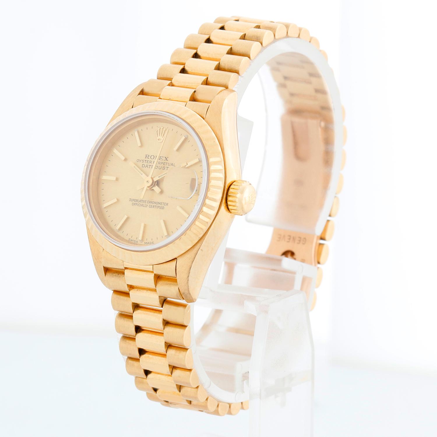 Rolex Ladies President 18K Yellow Gold 69178 Watch - Automatic winding, 29 jewels, Quickset date, sapphire crystal. Ladies President. 18k yellow gold case with Fluted bezel (26mm diameter). Champagne dial with gold stick markers. 18k yellow gold