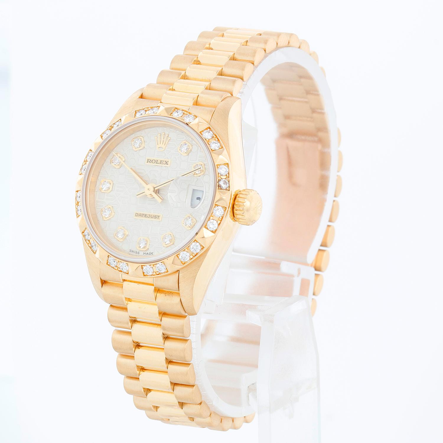 Rolex Ladies President 18K Yellow Gold 69258 Watch - Automatic winding. 18k yellow gold case with fixed Bead-Set Pyramid bezel   (26mm diameter). Silver jubilee  diamond dial. 18k yellow gold hidden-clasp President bracelet. Pre-owned with Rolex