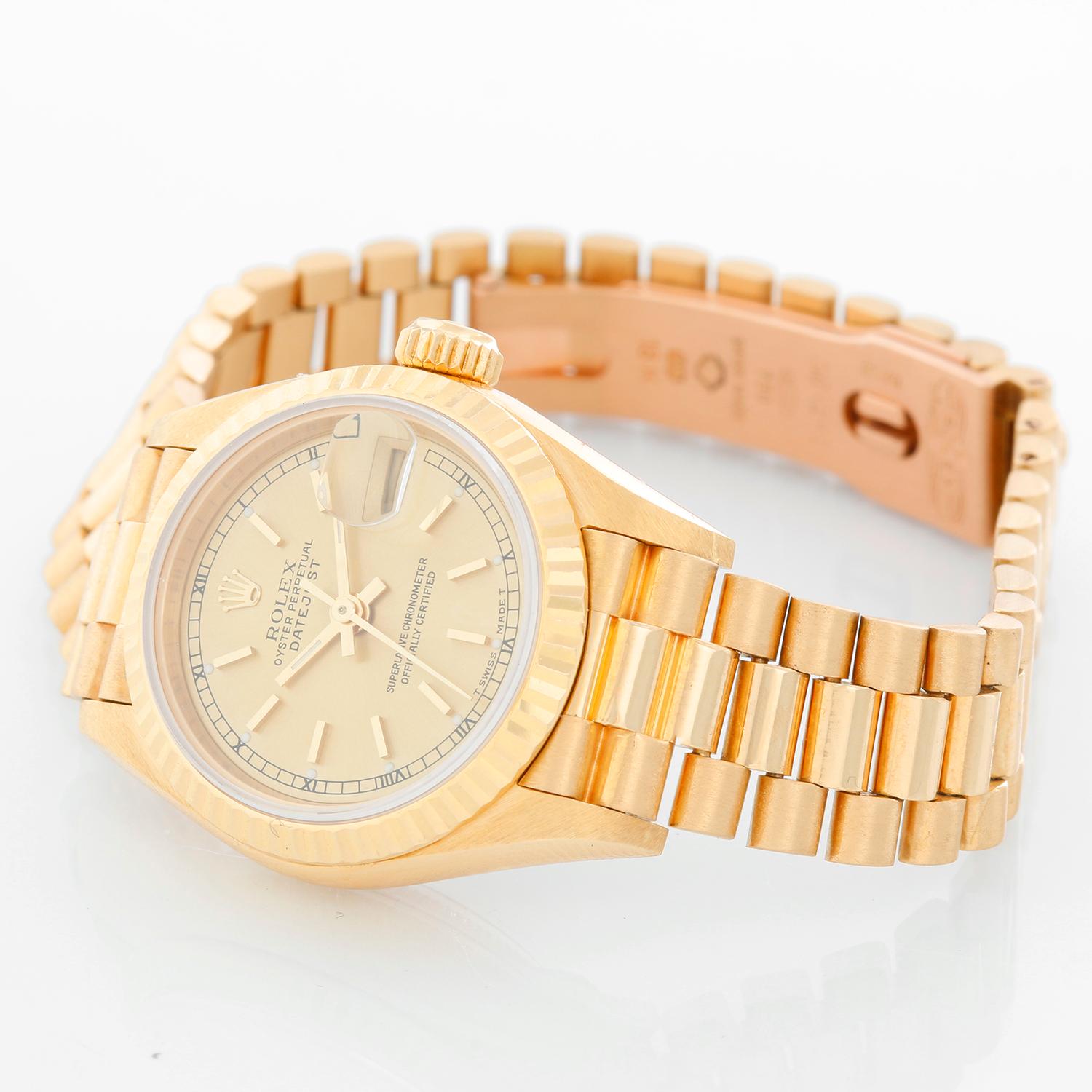 Rolex Ladies President 18k Yellow Gold Watch 69178 -  Automatic winding, 29 jewels, Quickset date, sapphire crystal. 18k yellow gold case  (26mm diameter). Silver dial with gold markers. 18k yellow gold Rolex hidden-clasp President bracelet.
