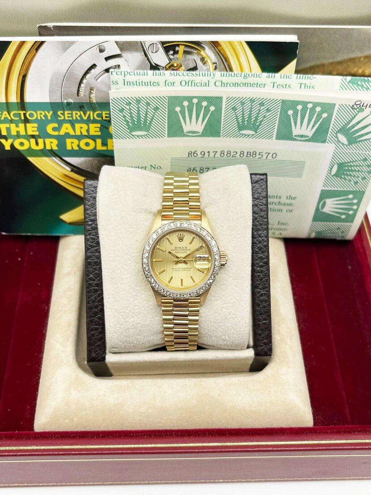Style Number: 69178

 

Serial: R687***



Model: Ladies President Datejust

 

Case Material: 18K Yellow Gold

 

Band: 18K Yellow Gold

 

Bezel: Custom Diamond bezel

 

Dial: Champagne Tapestry Dial

 

Face: Sapphire Crystal

 

Case Size:
