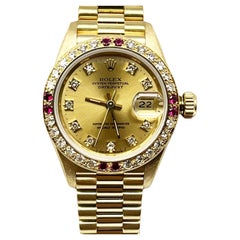 Rolex Ladies President 69178 Champagne Diamond Dial Ruby Bezel 18k Yellow Gold