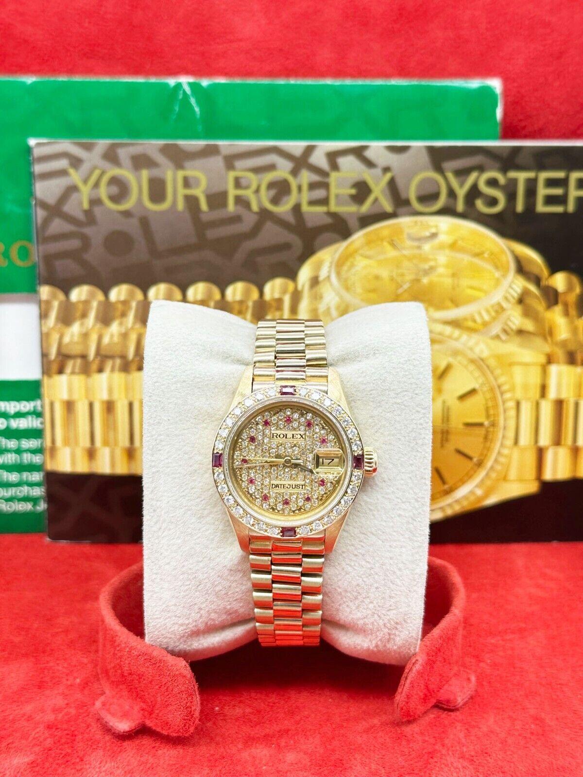 Style Number: 69178

Serial: N360***

Year: 1991 

Model: Ladies President 

Case Material: 18K Yellow Gold 

Band: 18K Yellow Gold 

Bezel: Custom Diamond and Ruby Bezel  

Dial: Custom Champagne Diamond and Ruby Dial  

Face: Sapphire Crystal 