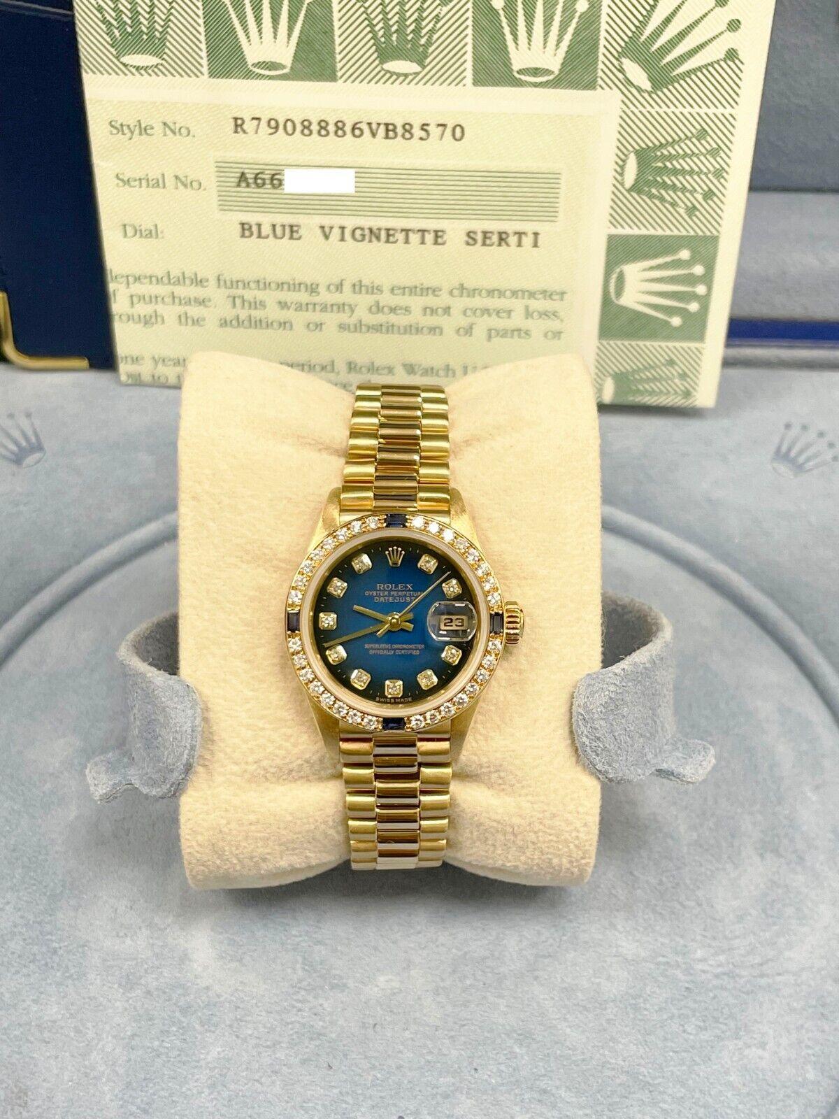 Style Number: 79080

 

Serial: A664***


Year: 2000

 

Model: Ladies President 

 

Case Material: 18K Yellow Gold

 

Band: 18K Yellow Gold

 

Bezel:  Original Factory Blue Sapphire and Diamond Bezel 

 

Dial: Original Factory Blue Diamond Dial