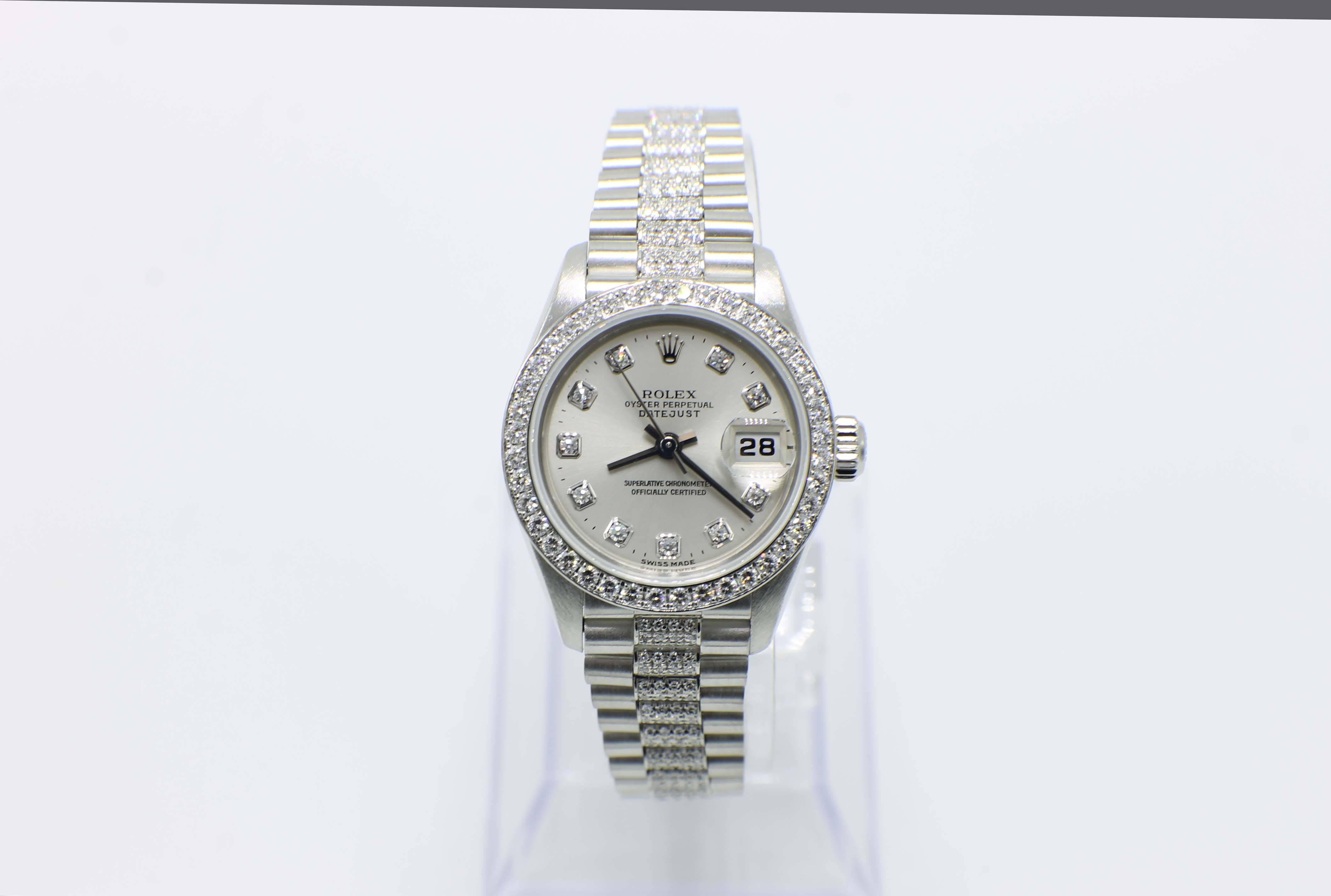 Style Number: 79136

Serial: P199***

Year: 2003

Model: Ladies President 

Case Material: Platinum

Band: Platinum with Diamonds on the Band

Bezel: Original Factory Diamond Bezel

Dial: Original Factory Silver Diamond Dial

Face: Sapphire