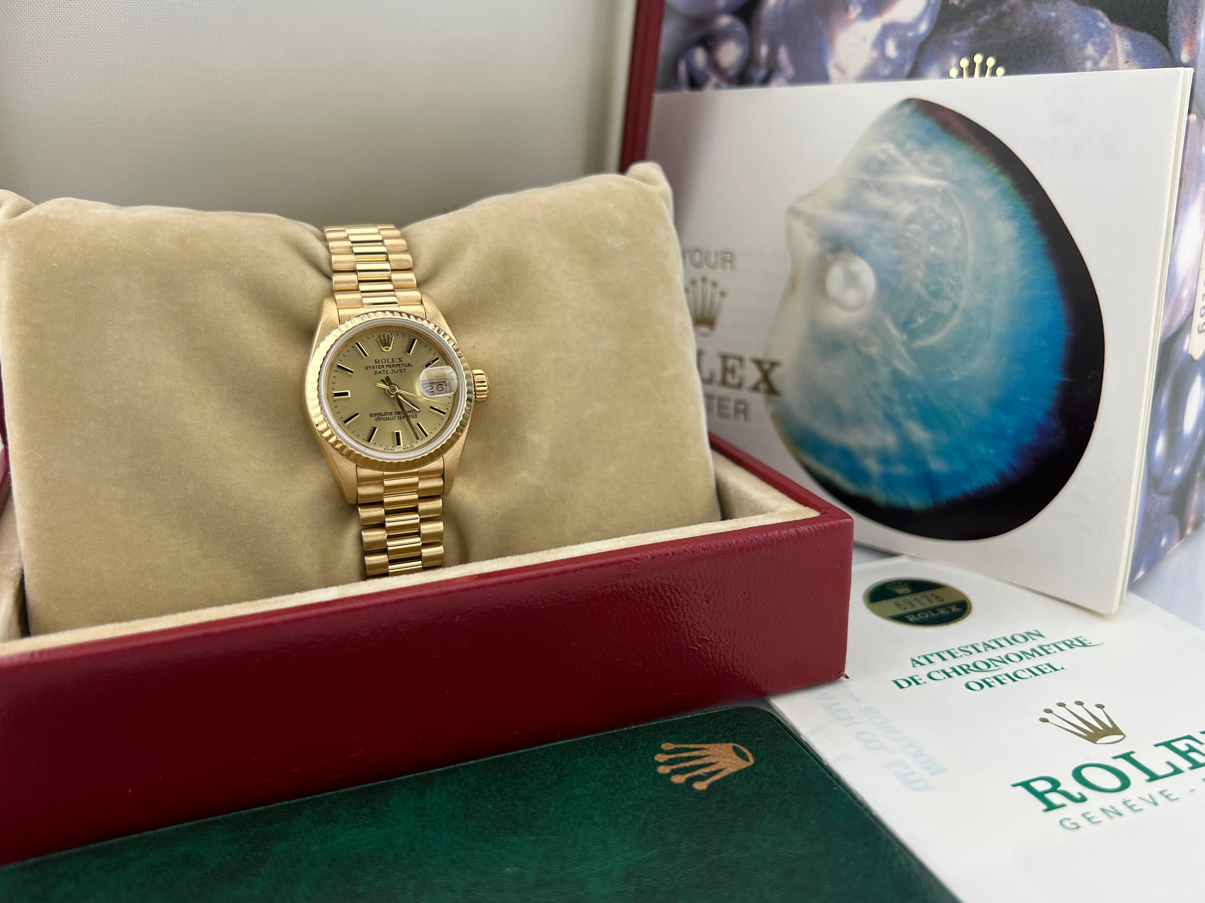 Style Number: 69178

Serial: 8312***

Model: Rolex Ladies President

Case Material: 18K Yellow Gold

Band: 18K Yellow Gold

Bezel: 18K Yellow Gold

Dial: Champagne

Face: Sapphire Crystal

Case Size: 26mm

Includes: 

-Rolex Box and