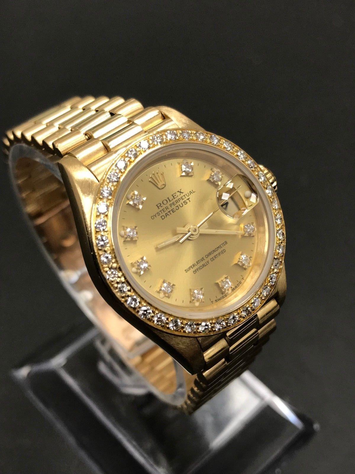 Style Number: 69178
Serial: L395***
Model: Datejust 
Case Material: 18K Yellow Gold 
Band: 18K Yellow Gold
Bezel: Custom Diamond Bezel 
Dial: Custom Diamond Dial 
Face: Sapphire Crystal 
Case Size: 26mm
Includes: 
-Elegant Watch Box
-Certified