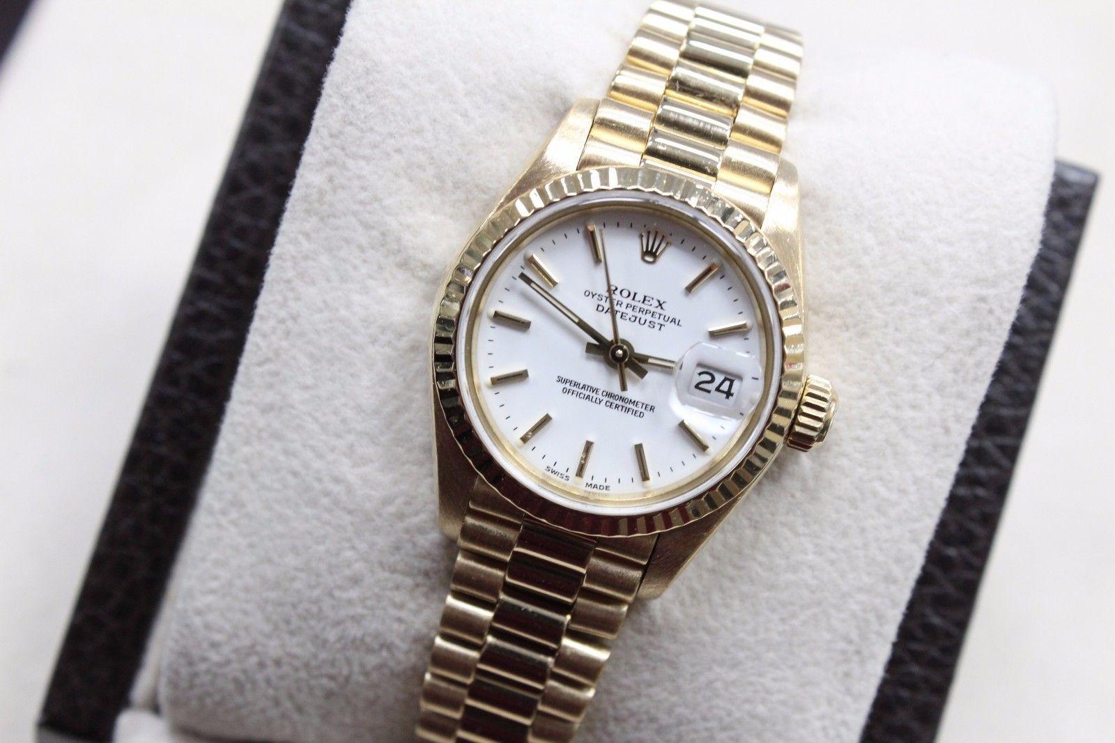 Style Number: 69178

Serial: 9502***

Model: Ladies President Datejust 

Case: 18K Yellow Gold

Band: 18K Yellow Gold

Bezel: 18K Yellow Gold

Dial: White

Face: Sapphire Crystal 

Case Size: 26mm

Includes: 

-Elegant Watch Box 

-Certified