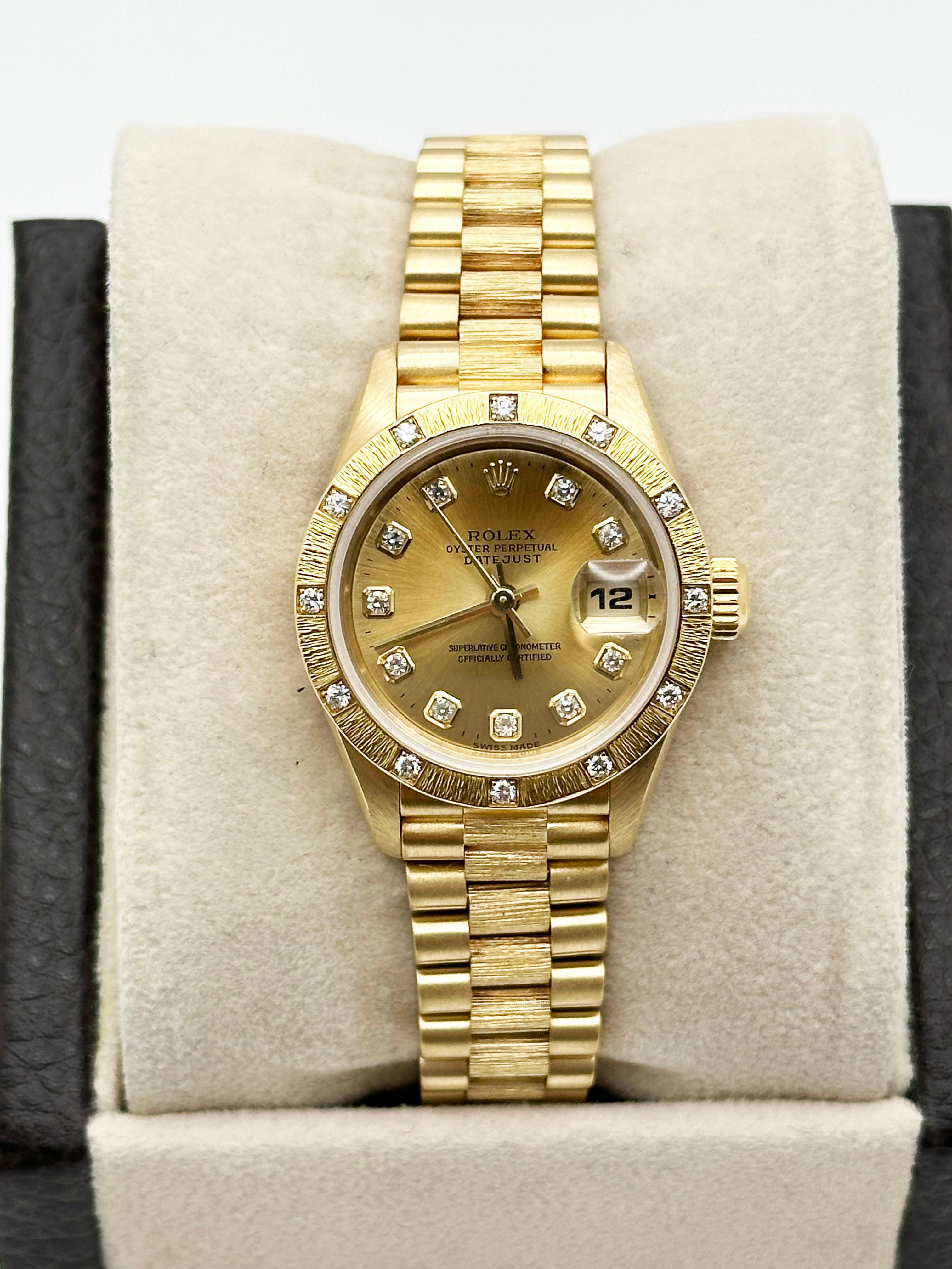 Style Number: 69288


Serial: W745***



Year: 1995

 

Model: Rolex Ladies Datejust President 

 

Case Material: 18K Yellow Gold 

 

Band: 18K Yellow Gold Bark President Bracelet

  

Bezel: Original Factory 18K Yellow Gold Bark Diamond Bezel 

 