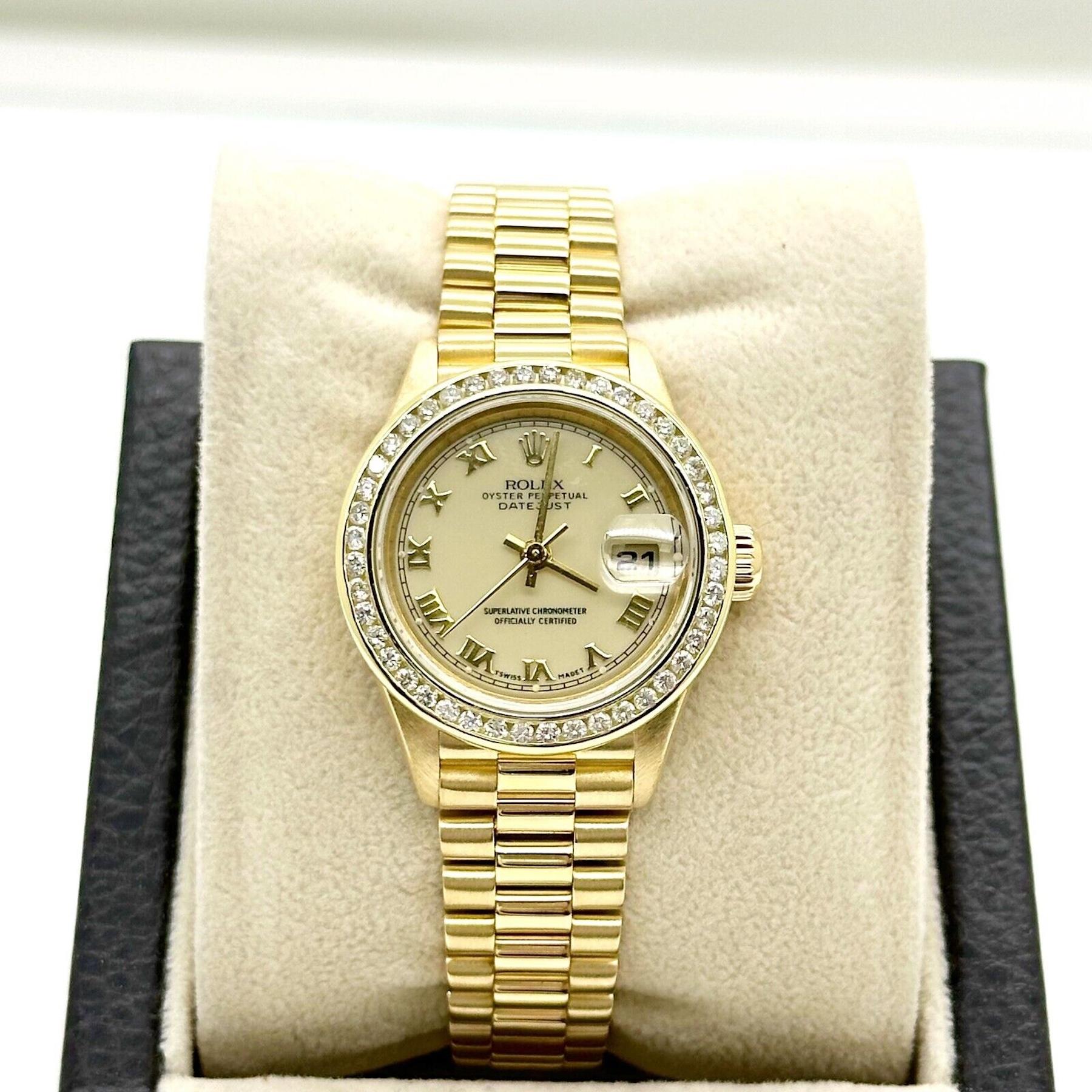Style Number: 79178

Serial: A113***

Year: 1999

Model:  Ladies President Datejust
  
Case Material: 18K Yellow Gold

Band: 18K Yellow Gold

Bezel: Custom Diamond Bezel
 
Dial: Cream Roman Dial

Face: Sapphire Crystal

Case Size: 26mm

Includes: