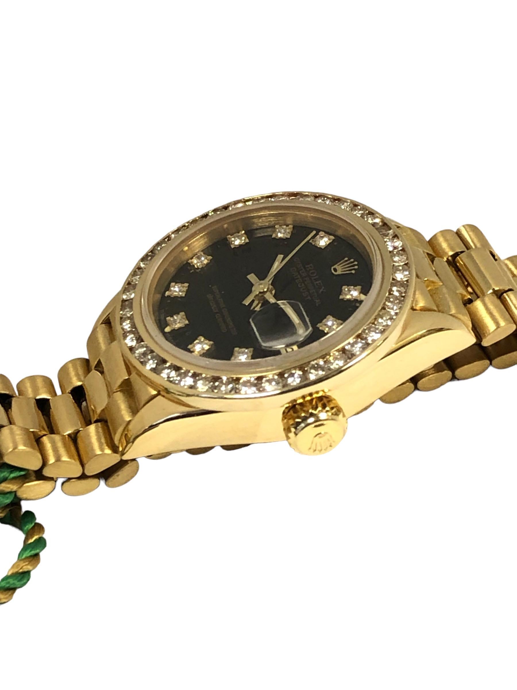 Circa 1988 Rolex Presidential model Ladies Reference 69138 Wrist Watch, 26 M.M. 18k Yellow Gold 3 piece water resistant Oyster case. After Market Full cut Diamond bezel totaling approximately 1 Carat,  29 Jewel Caliber 2135 Automatic, self winding