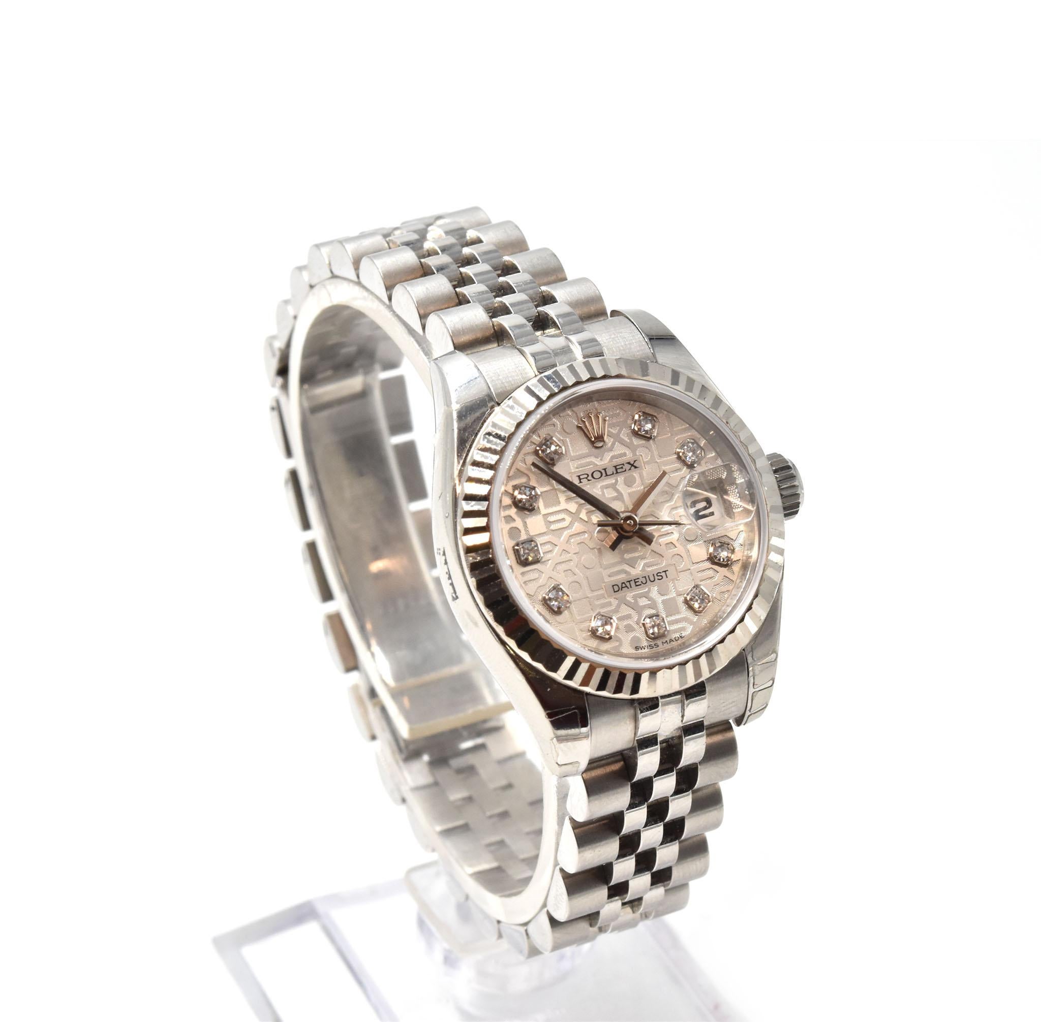 Movement: automatic Rolex caliber 2235 movement
Function: hours, minutes, seconds, date
Case: round 26mm stainless steel case with 18k white gold fluted bezel, sapphire protective crystal, screw-down crown, water resistant to 100 meters
Band: