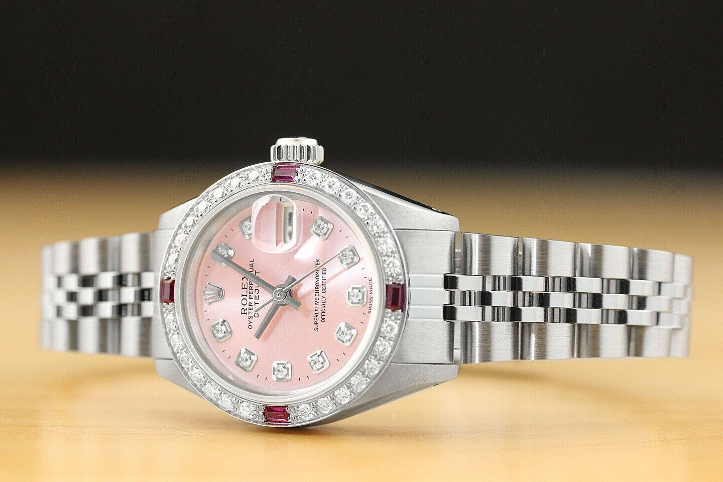 Rolex Ladies Watch Datjust Diamond 18 Karat  White Gold   

Custom Pink Rolex stands out with the 4 Ruby  stones and with 40 diamonds  and can be sent from  USA  too 
We can show other variations and if this becomes unviable one like will be