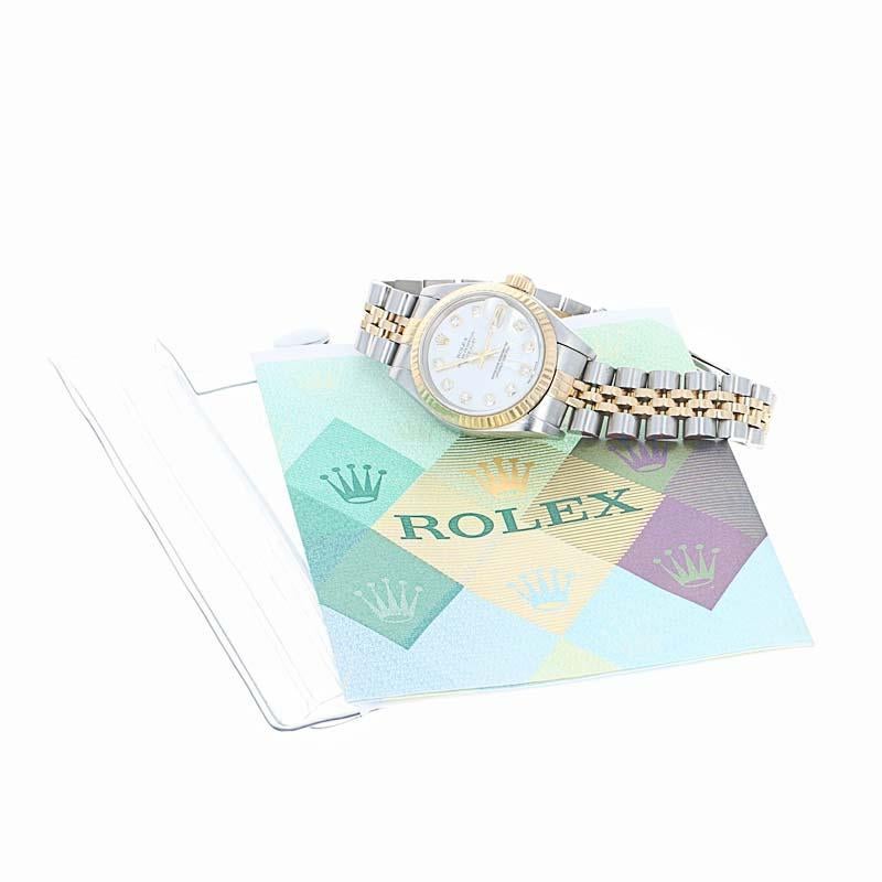 This is an authentic Rolex Oyster Datejust Ladies wristwatch. The watch features a factory dial of mother of pearl and genuine diamonds. The watch has been professionally serviced and comes with a two year warranty. This is also accompanied by its