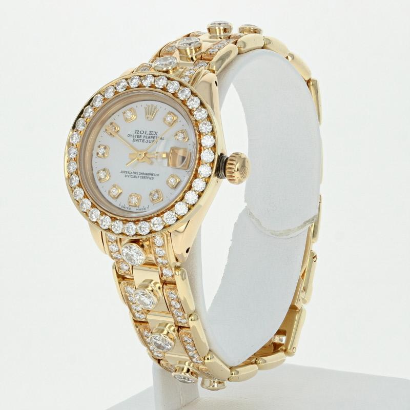 This lovely ladies wristwatch has an authentic Rolex movement and case. The band, dial and bezel are after market but in great serviced and working condition. This is a custom variation on a pearlmaster style.  The watch has been professionally