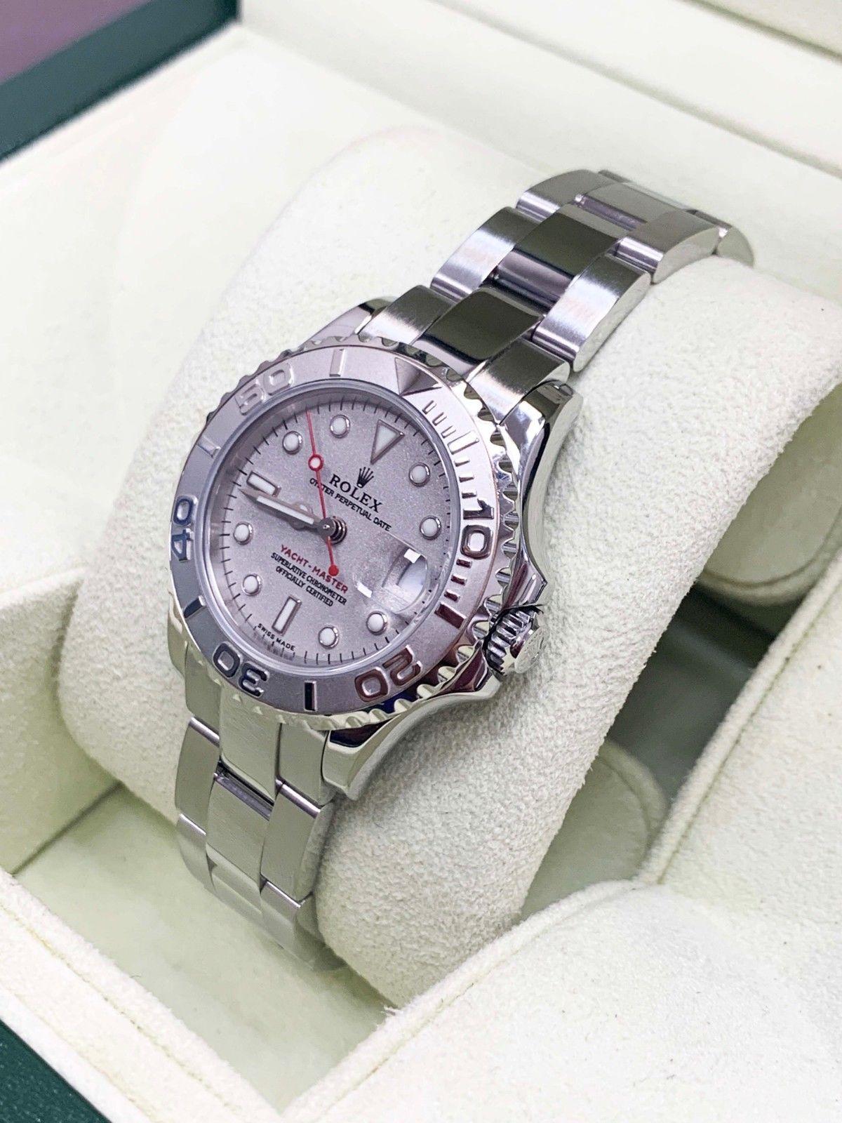 Style Number: 169622
Serial: D931***
Year: 2006
Model: Yacht Master 
Case Material: Stainless Steel 
Band: Stainless Steel
Bezel: Platinum 
Dial: Silver
Face: Sapphire Crystal 
Case Size: 29mm
Includes: 
-Rolex Box & Papers
-Certified Appraisal 
-6