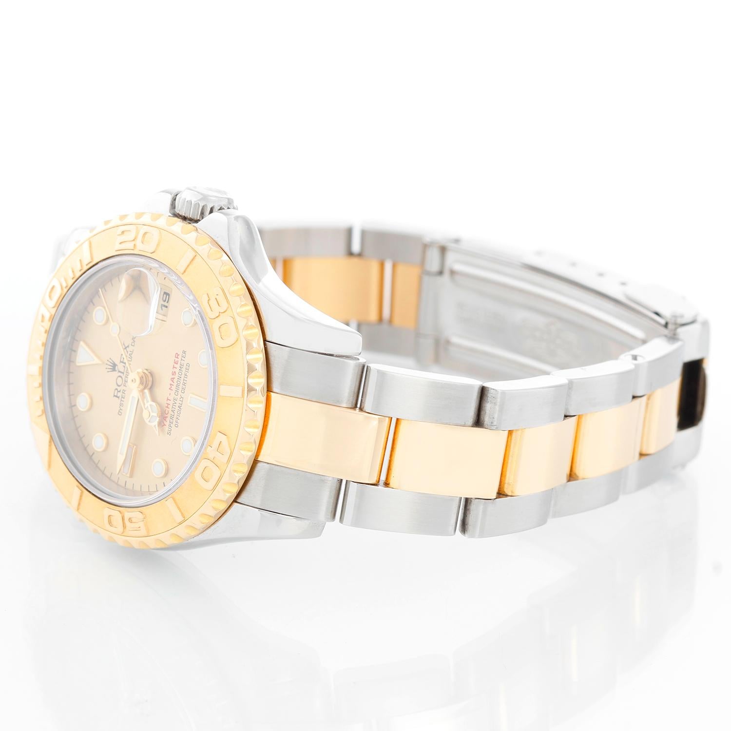 Rolex Ladies Yacht-Master 2-Tone Watch 169623 - Automatic winding; sapphire crystal. Stainless steel case with 18k yellow gold bezel ( 29 mm ) . Champagne dial with luminous hour markers. Stainless steel and 18k yellow gold Oyster bracelet with
