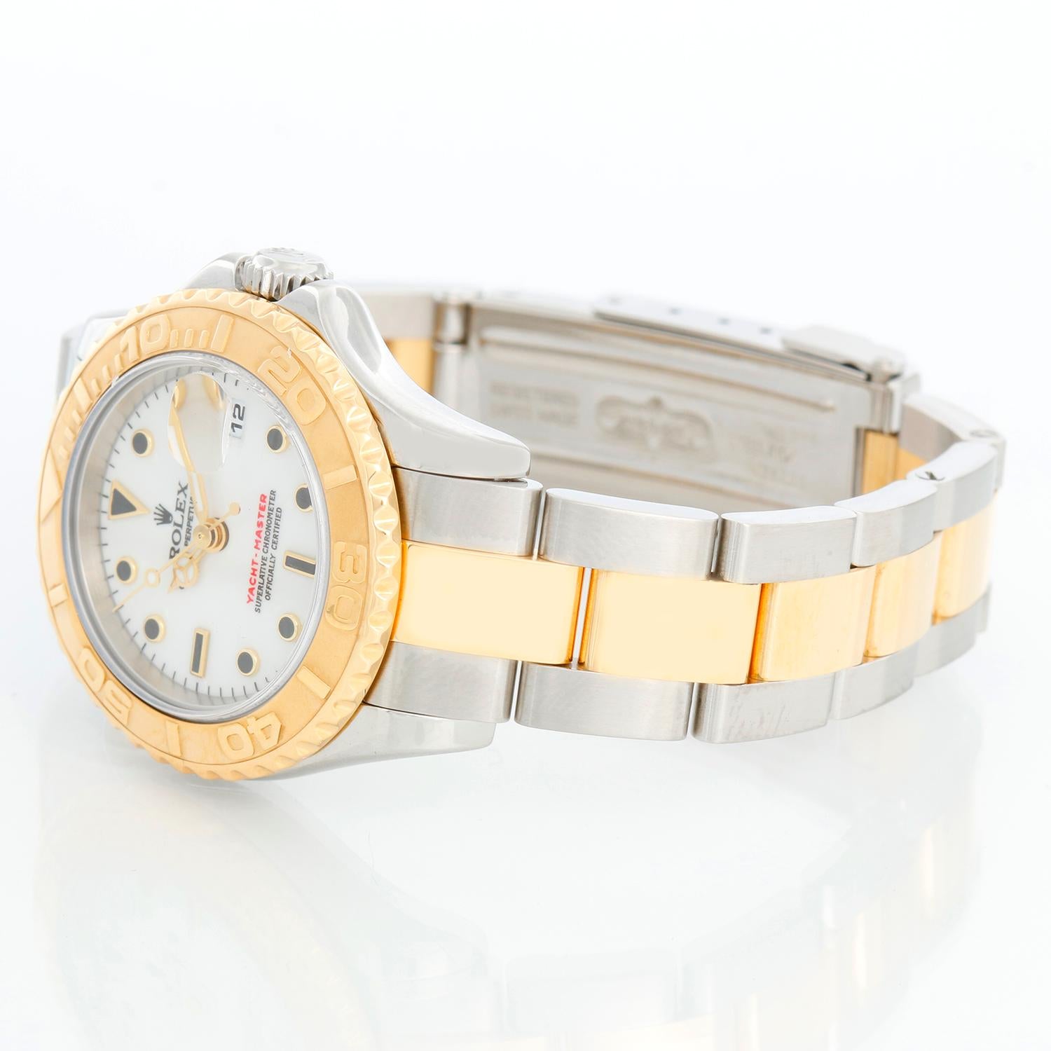 Rolex Ladies Yacht-Master 2-Tone Watch 169623 White Dial - Automatic winding; sapphire crystal. Stainless steel case with 18k yellow gold bezel ( 29 mm ). White dial with black hour markers. Stainless steel and 18k yellow gold Oyster bracelet with