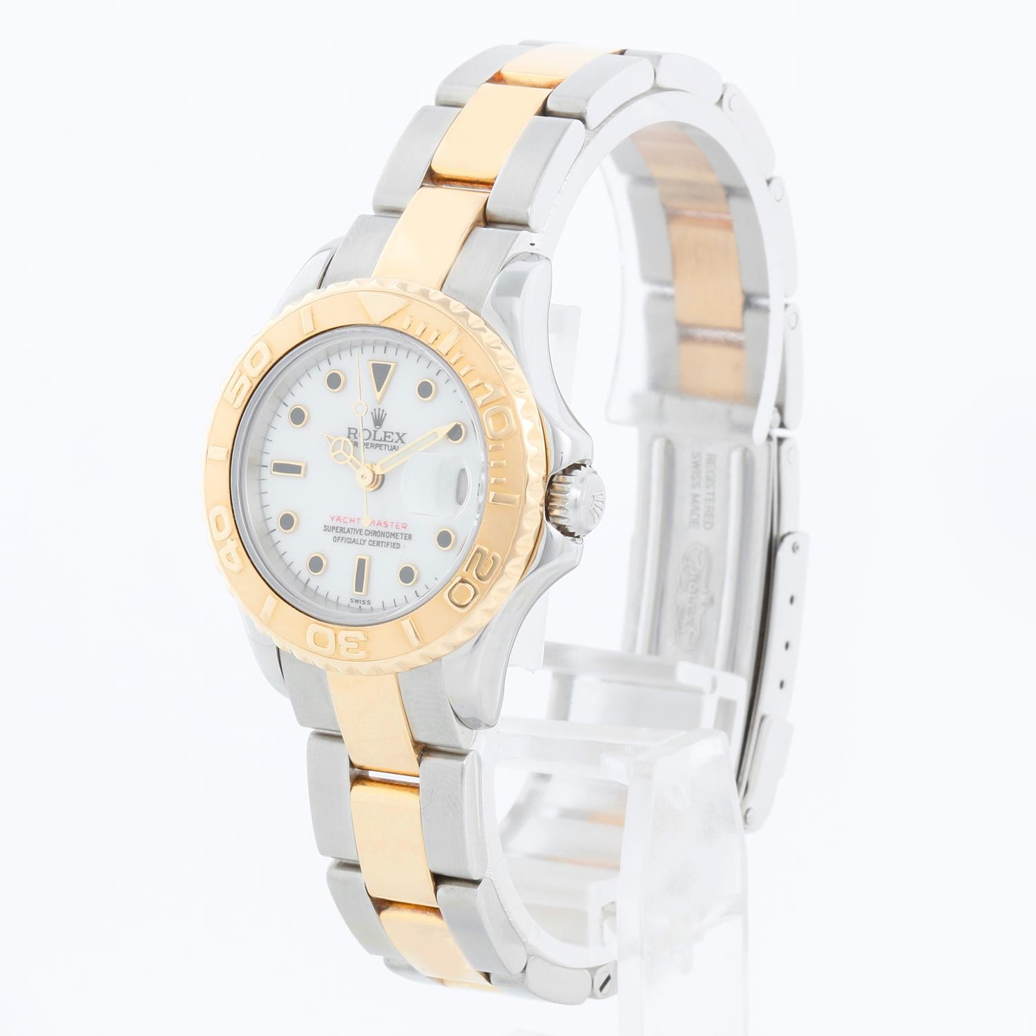 Rolex Ladies Yacht-Master 2-Tone Watch 69623 White Dial - Automatic winding; sapphire crystal. Stainless steel case with 18k yellow gold bezel . White dial with black hour markers. Stainless steel and 18k yellow gold Oyster bracelet with flip-lock