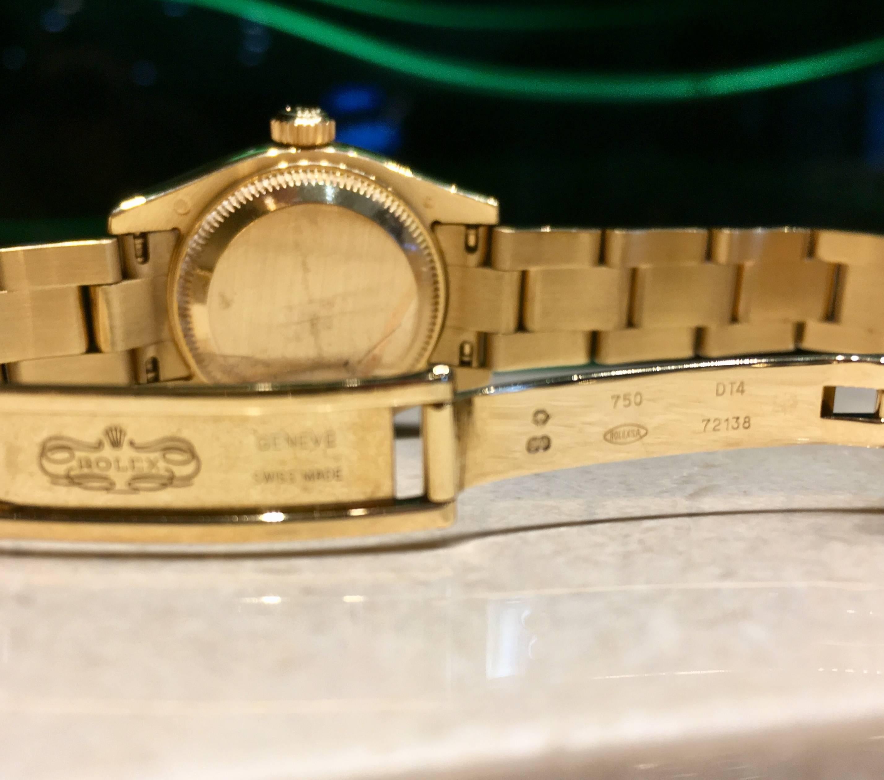 Rolex lady's 18k yellow gold Datejust estate wristwatch, Ref. 179178, 26mm, circa 2001, mother of pearl dial with roman numerals, oyster bracelet, inside bracelet measurement is approximately 6.25 inches, 10 links, classic fluted bezel, automatic
