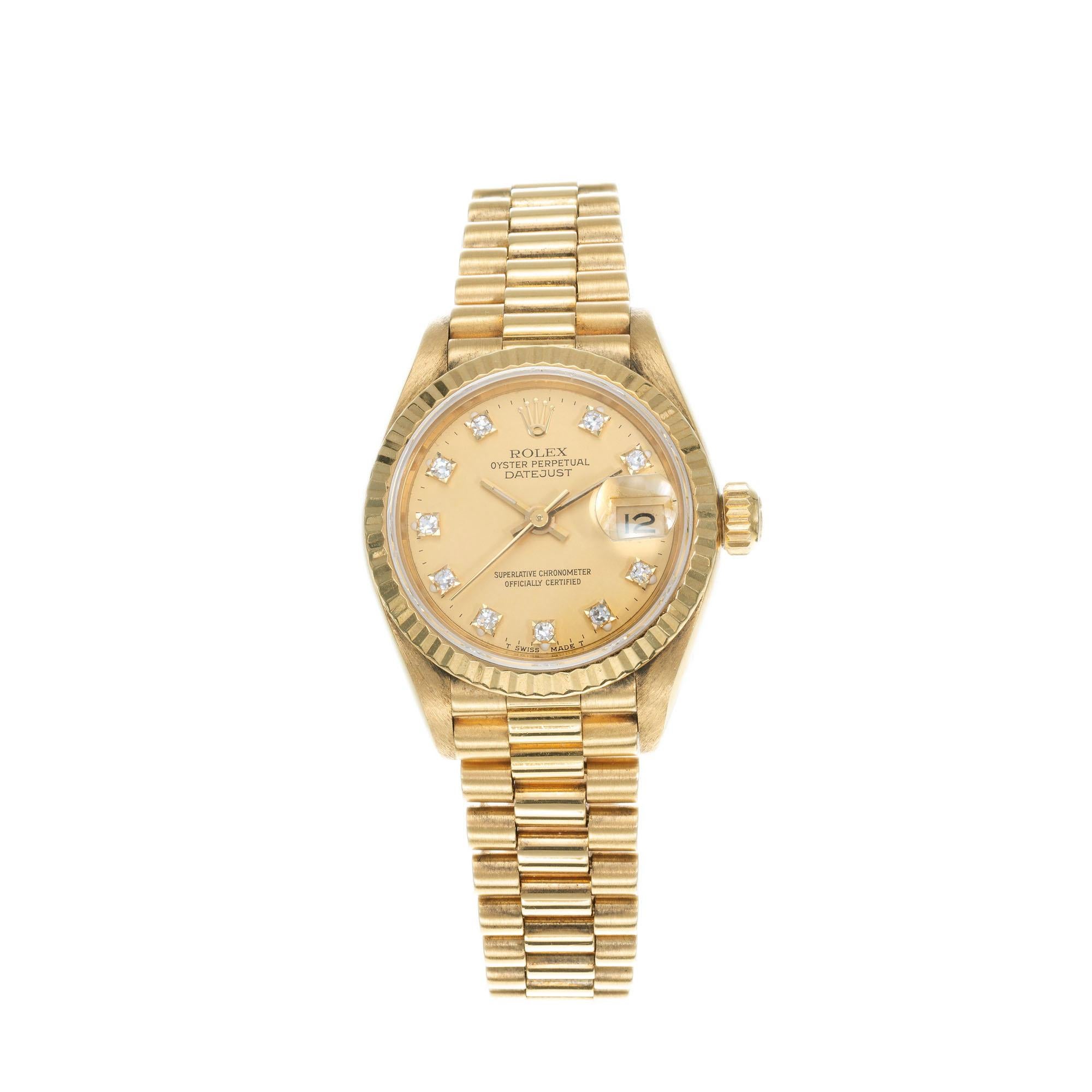 Rolex lady's 18k yellow gold Datejust with factory diamond dial, Ref. 69178, circa 1987.

10 round diamonds
18k yellow gold 
74.8 grams
Length: 6.75 inches
Width without crown: 26mm
Width with crown: 28.58mm
Band width at case: 13mm
Case thickness: