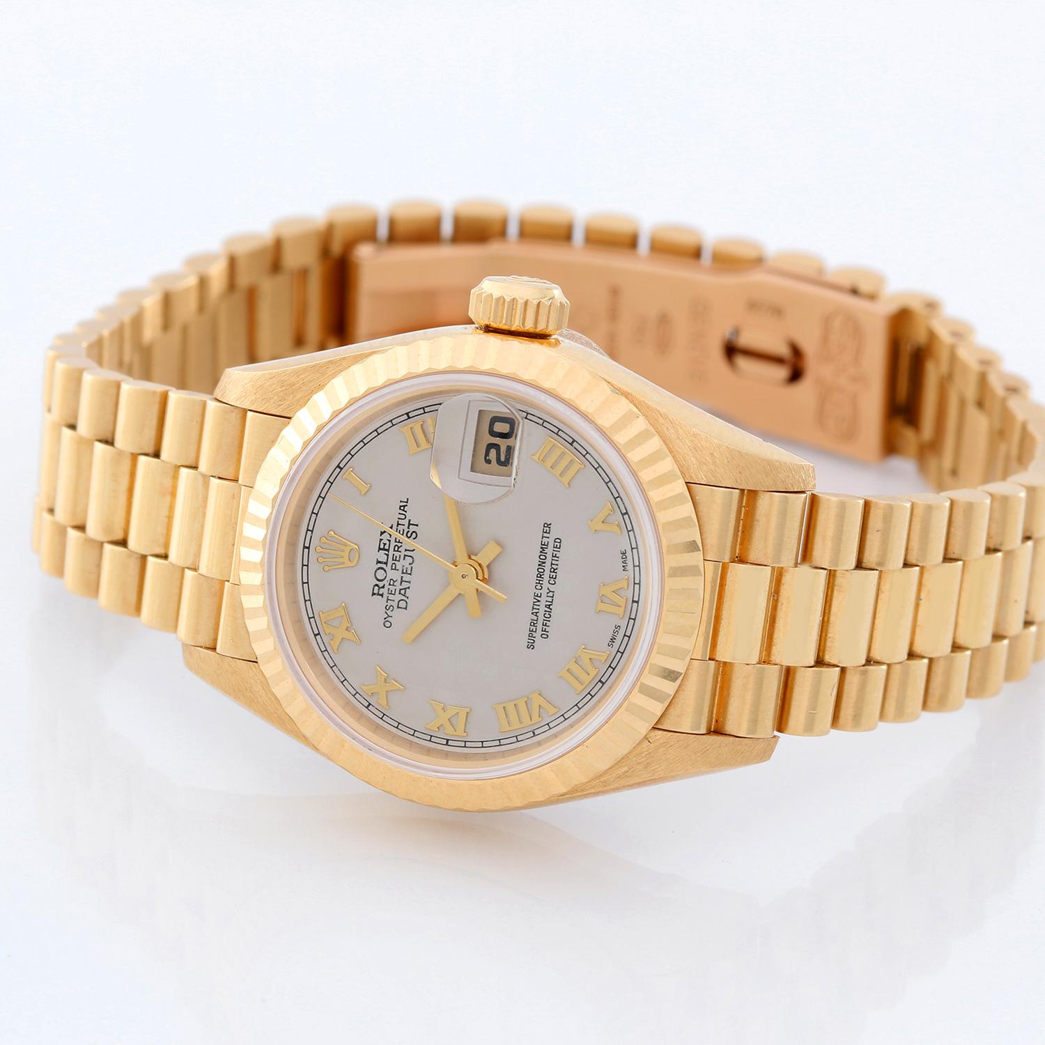 Rolex Ladies President 18k Yellow Gold Watch 79178 - Automatic winding, 31 jewels, Quickset date, sapphire crystal. 18k yellow gold case with factory diamond bezel  (26mm diameter). Cream Pyramid dial with Roman numerals. 18k yellow gold Rolex