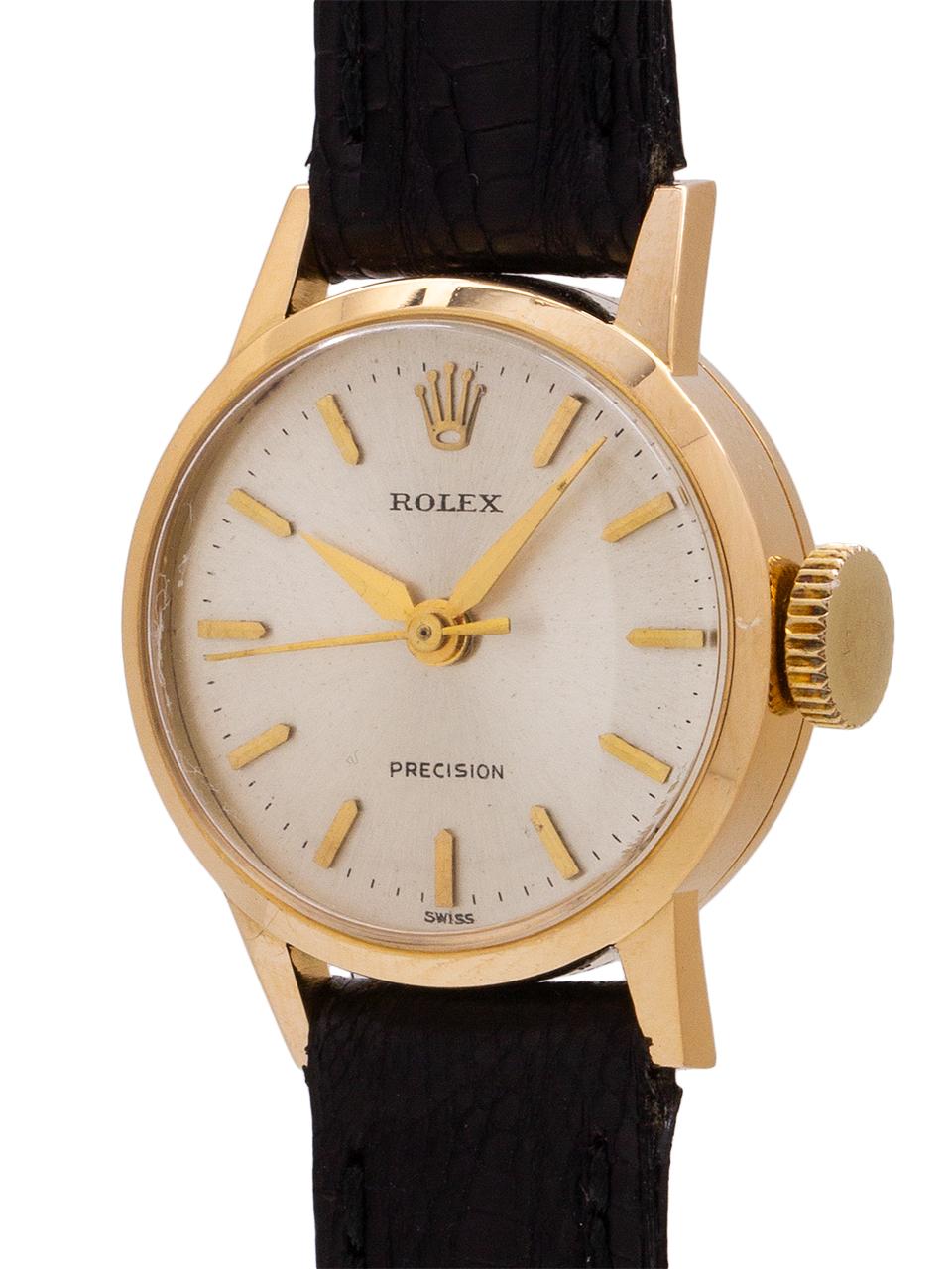 
A scarce and simple design vintage lady’s Rolex 18K YG dress model circa 1950’s. Featuring a 20mm heavy snap back case with pronounced and angled lugs and featuring a beautiful matte silvered satin dial with applied gold indexes, applied Rolex