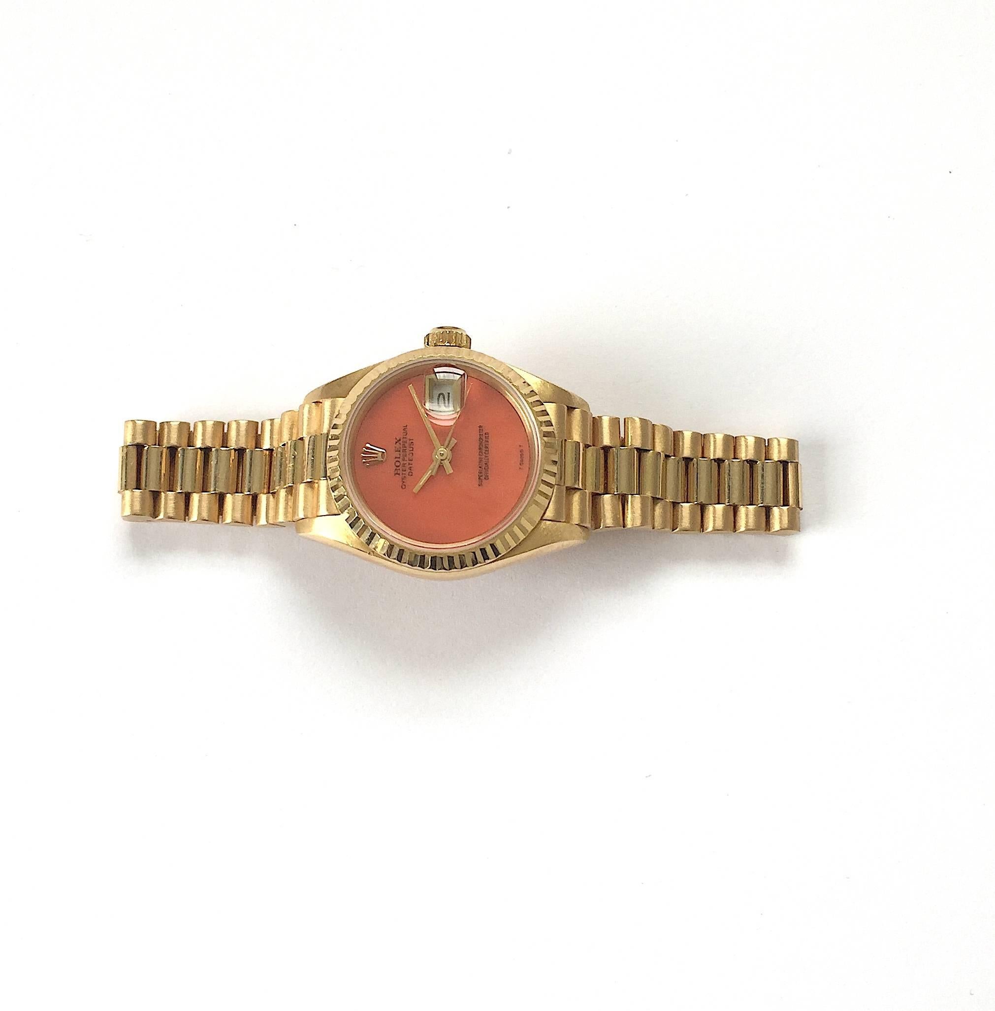 Rolex Ladies Yellow Gold President Coral Dial Datejust Automatic Wristwatch In Excellent Condition For Sale In New York, NY